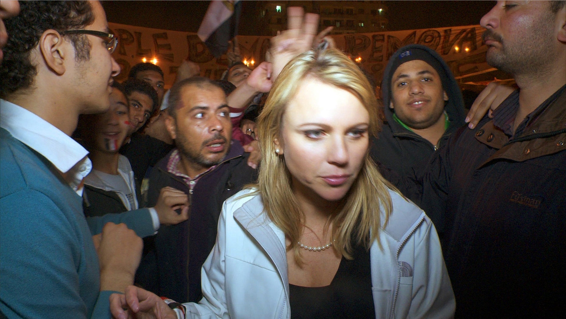In a photo released by CBS, "60 Minutes" correspondent Lara Logan covers the reaction in Cairo's Tahrir Square the day Egyptian President Hosni Mubarak stepped down. CBS News says Logan was attacked, beaten and sexually assaulted before being saved by a group of women and Egyptian soldiers.