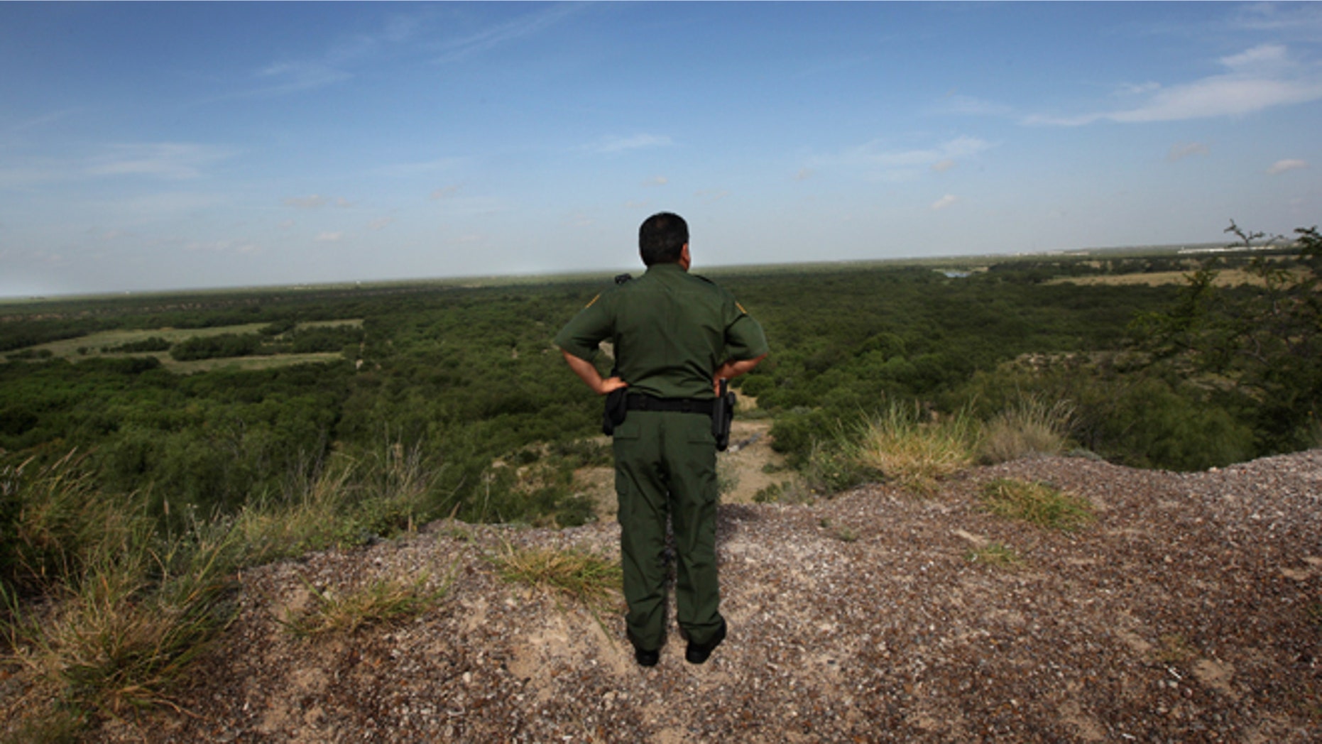 LAREDO, TX - AUGUST 07: U.S. Border Patrol supervisor Eugenio Rodriguez looks over the landscape near the Rio Grande River and surrounding environs August 7, 2008 in Laredo, Texas. U.S. Border patrol agents constantly monitor the border for illegal crossings, as part of their efforts to stop illegal immigrants, drug traffickers and terrorists from crossing illegally into the United States. Securing the nation's borders is an important topic in this year's presidential campaign. Since 9/11, the Border Patrol has grown by about a third to more than 15,000 agents. (Photo by John Moore/Getty Images)