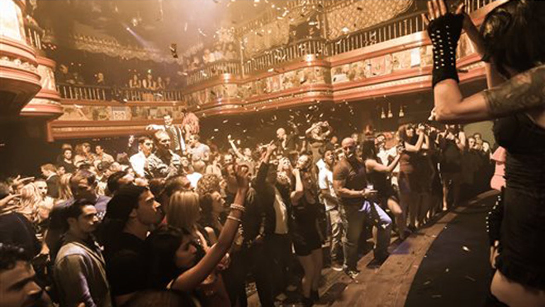 In this image provided by The Act nightclub, patrons enjoy a perfromance at the club located at the Palazzo hotel-casino on the Las Vegas Strip. The Palazzo is trying to terminate their 10-year agreement with the nightclub after 10 months of operation. They say the shows at the venue inside the Palazzo are so raunchy they violate obscenity laws. (AP Photo/The Act Nightclub, Denise Truscello )