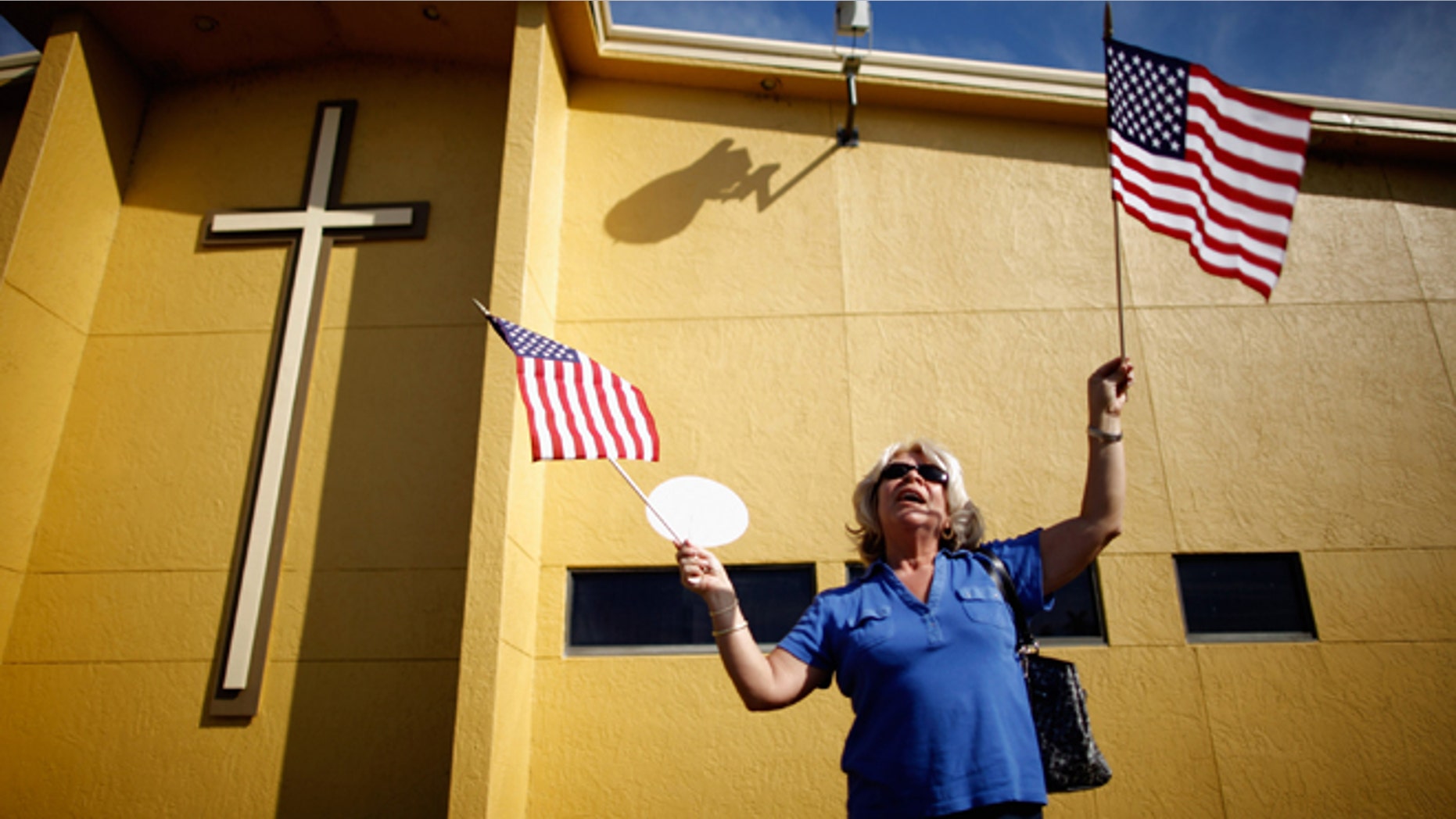 A supporter of Republican presidential candidate and former Speaker of the House Newt Gingrich (R-GA) waits for his arrival outside Centro de la Familia evangelical church January 28, 2012 in Orlando, Florida.