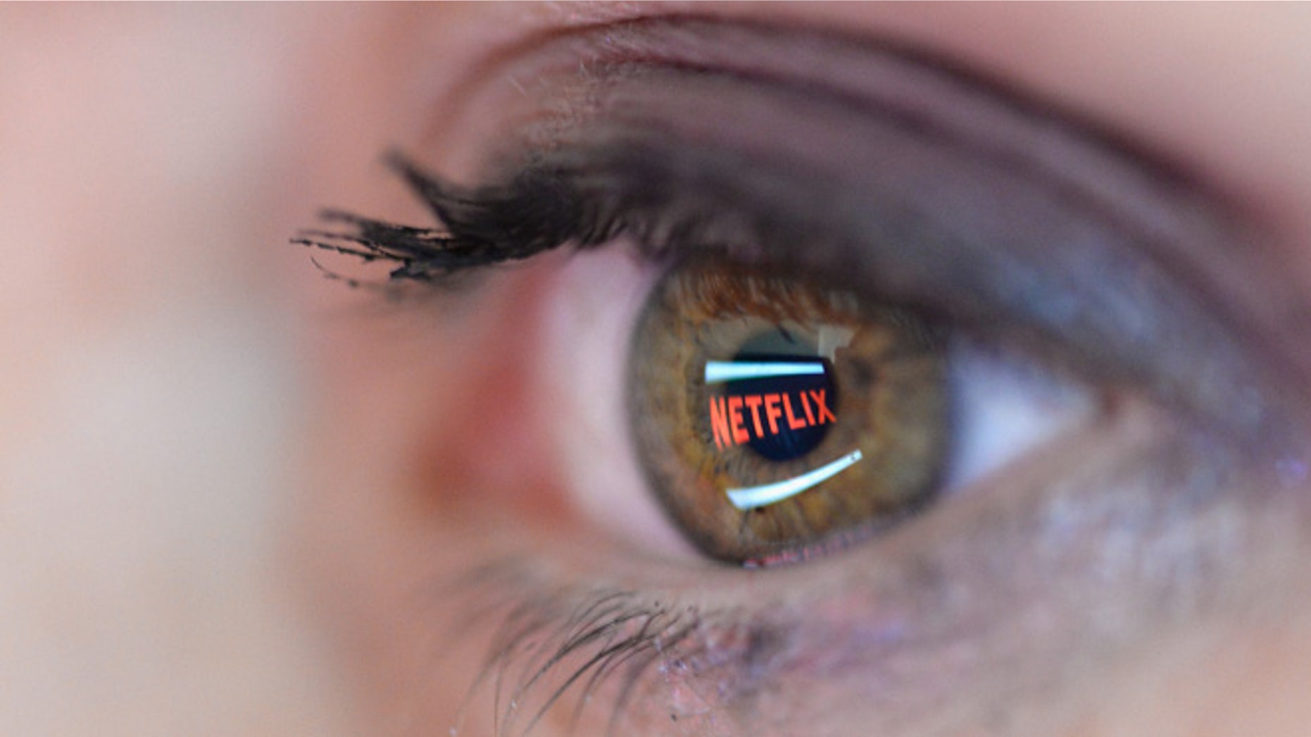 PARIS, FRANCE - SEPTEMBER 19: In this photo illustration the Netflix logo is reflected in the eye of a woman on September 19, 2014 in Paris, France. Netflix September 15 launched service in France, the first of six European countries planned in the coming months. (Photo by Pascal Le Segretain/Getty Images)