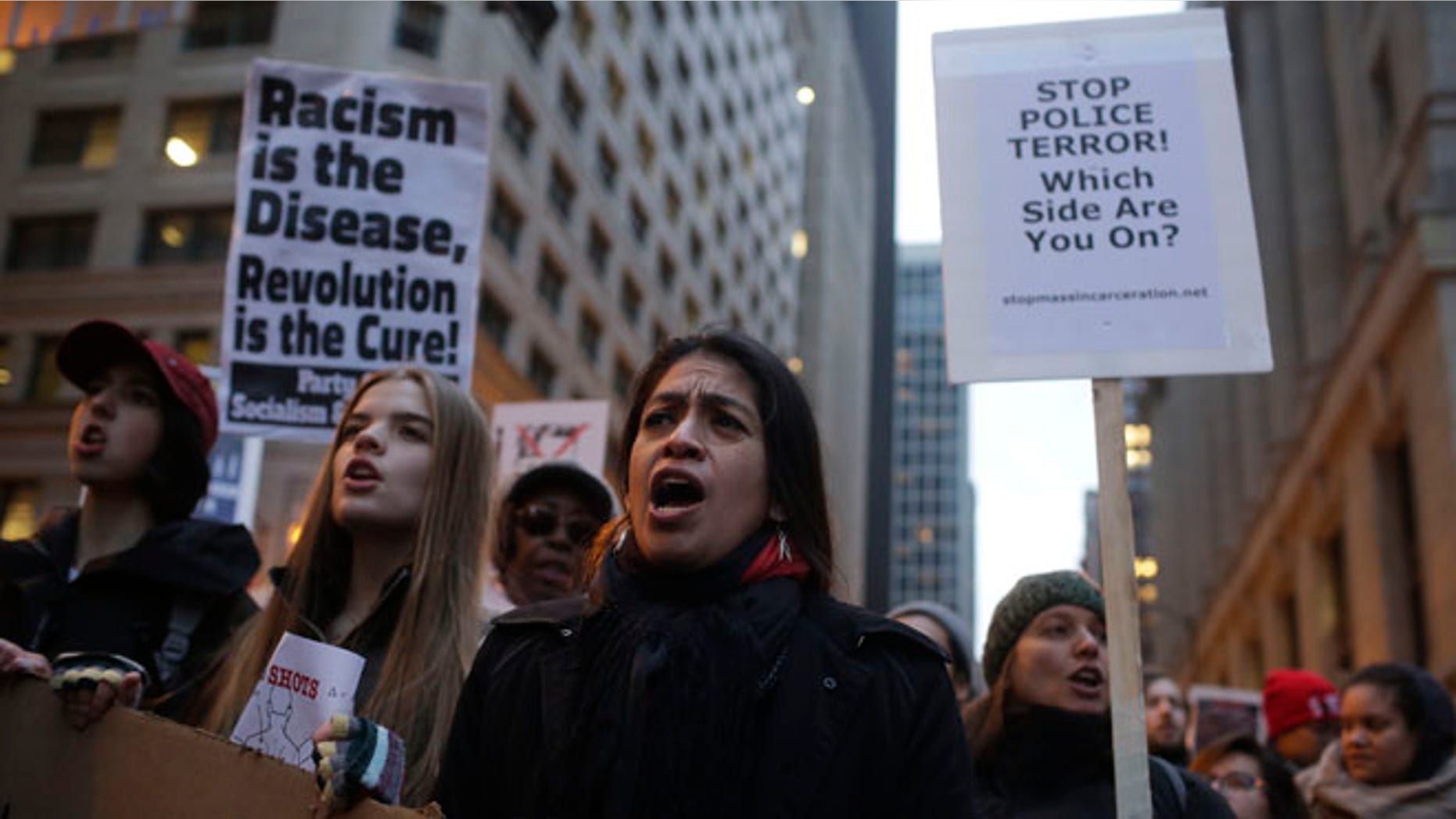 CHICAGO, IL - DECEMBER 18 : Demonstrators continue to protest the fatal police shooting of Laquan McDonald December 18, 2015 in Chicago, Illinois. Former Chicago police officer Jason Van Dyke, who was charged with murder last month in the shooting death of 17-year-old McDonald last year, was indicted on six counts of first-degree murder and one count of official misconduct earlier this week. (Photo by Joshua Lott/Getty Images)