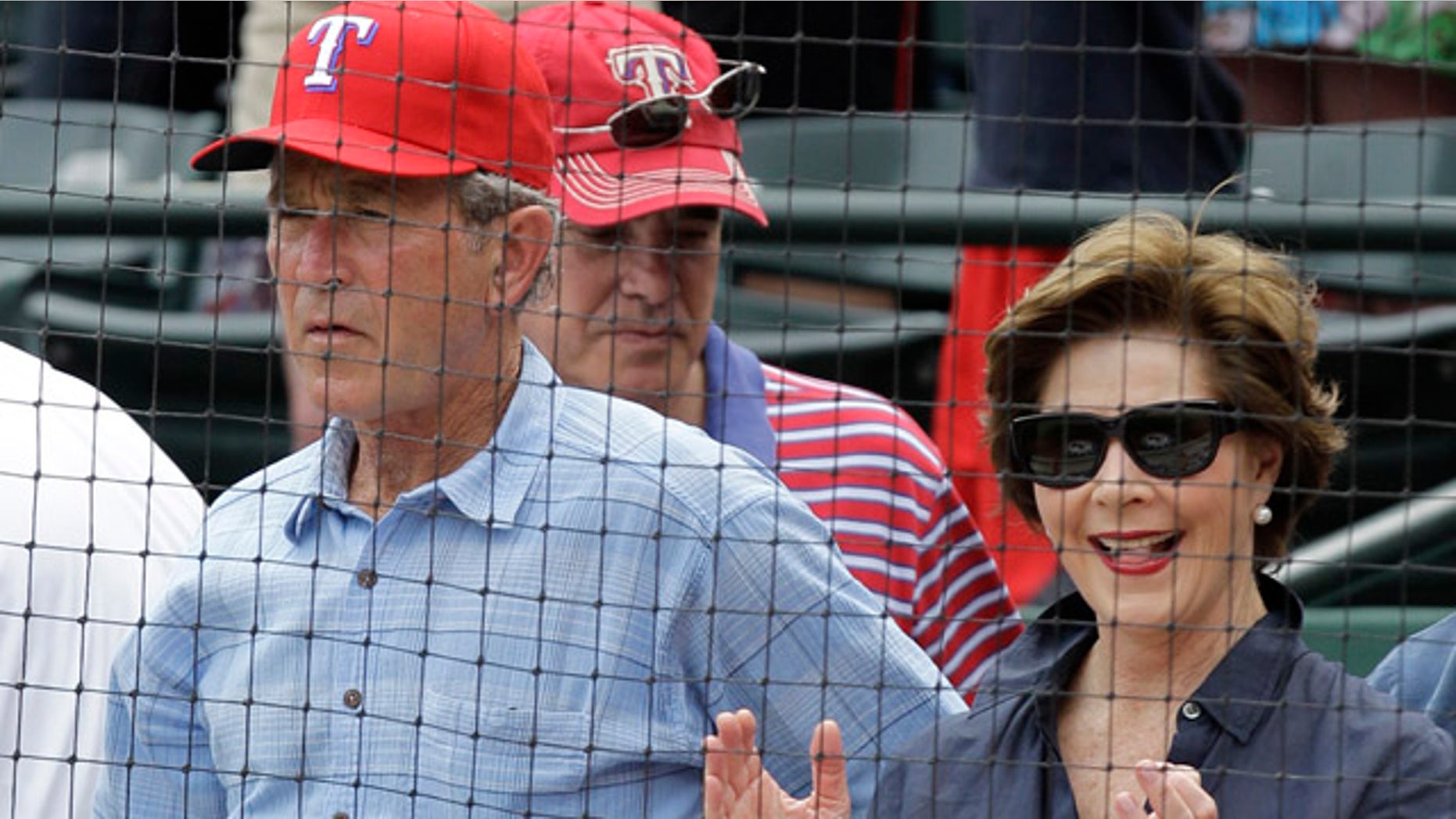 April 24: Former president George W. Bush and Laura take in an afternoon baseball game between the Texas Rangers and the Kansas City Royals