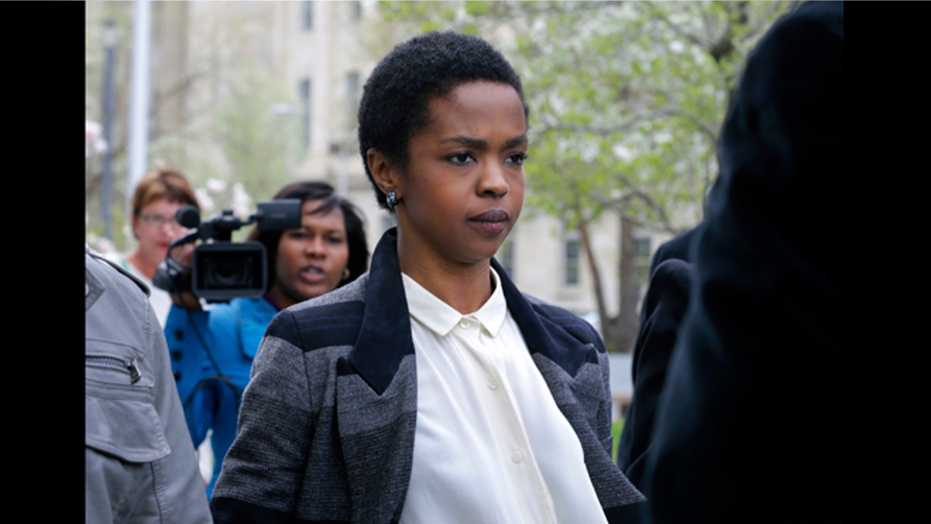 This April 22, 2013 file photo shows singer Lauryn Hill walking from federal court in Newark, N.J. Hill faced sentencing Monday, May 6, on federal tax charges. Hill pleaded guilty last year to not paying federal taxes on $1.8 million earned from 2005 to 2007. A judge two weeks ago said Hill had paid only about $50,000 of more than $500,000 she owes.