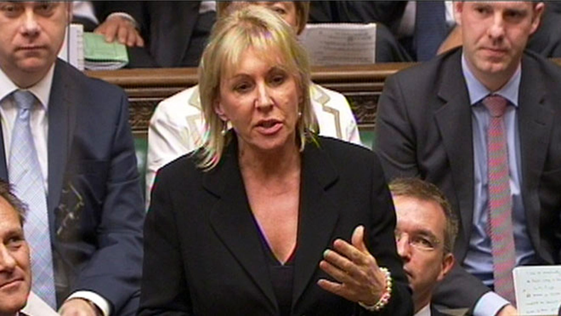 In this photo made from video on Sept. 5, 2012, Conservative MP Nadine Dorries talks during Parliament, in London.