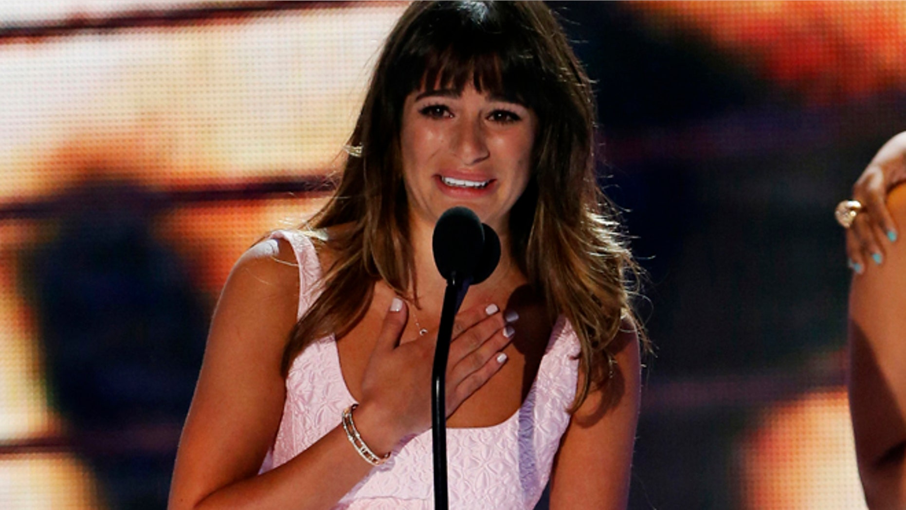 Actress Lea Michele accepts the Choice TV Actress: Comedy Award at the Teen Choice Awards at the Gibson amphitheatre in Universal City, California August 11, 2013.