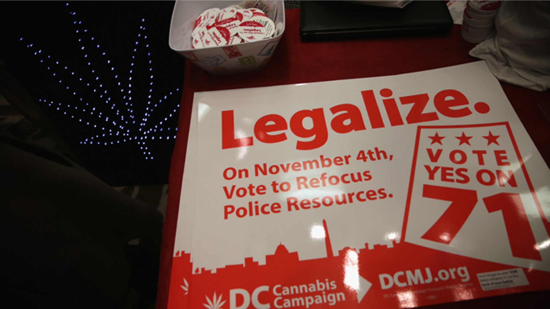 WASHINGTON, DC - FEBRUARY 28: Posters and stickers regarding Washington, DC's marijuana legalization are seen during a ComfyTree Cannabis Academy conference February 28, 2015 in Washington, DC. Attendees participated in the conference to gain knowledge on how to legally enter and operate in the cannabis industry. (Photo by Alex Wong/Getty Images)