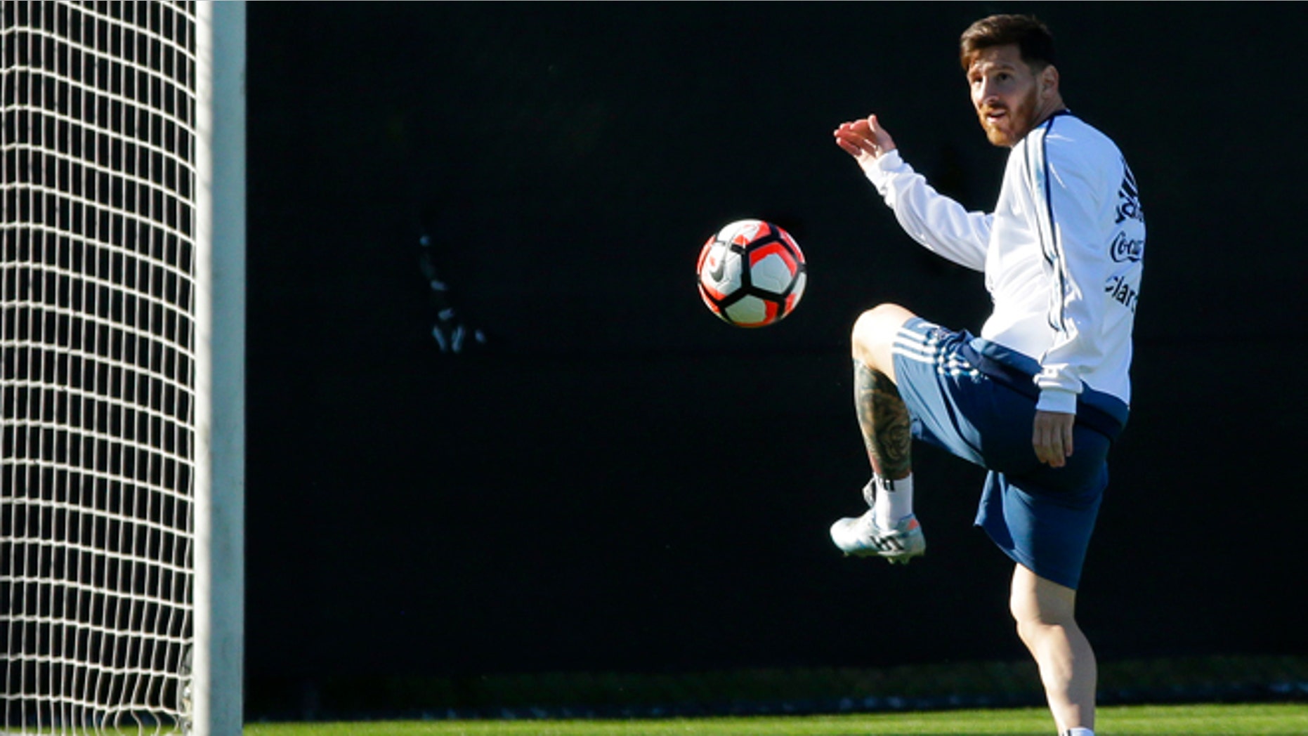 Argentina midfielder Lionel Messi kicks the ball during practice, Monday, June 13, 2016, in Tukwila, Wash. Argentina is scheduled to face Bolivia on Tuesday in a Copa America Centenario soccer match in Seattle. (AP Photo/Ted S. Warren)
