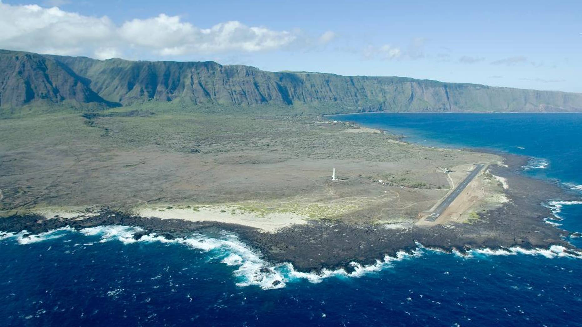 FILE -This Aug. 12, 2008, file photo, shows an aerial view of Kalaupapa Peninsula on Molokai, Hawaii. A handful of people with leprosy are still living full time on the isolated peninsula, but the National Park Service is already making plans to overhaul buildings and allow more visitors to the area when the last of the patients dies. (AP Photo/Hugh E. Gentry, File)