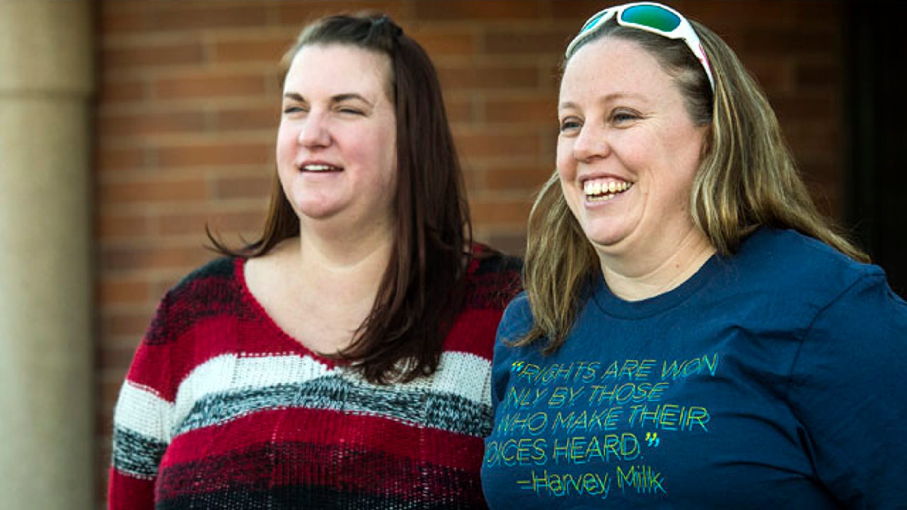 Nov. 13, 2015: April Hoagland, left, and Beckie Peirce smile during a press conference outside of the Juvenile Court in Price, Utah after a judge reversed his ruling to take their 9-month-old child and place her with a heterosexual couple for her well-being. (Chris Detrick/The Salt Lake Tribune via AP)