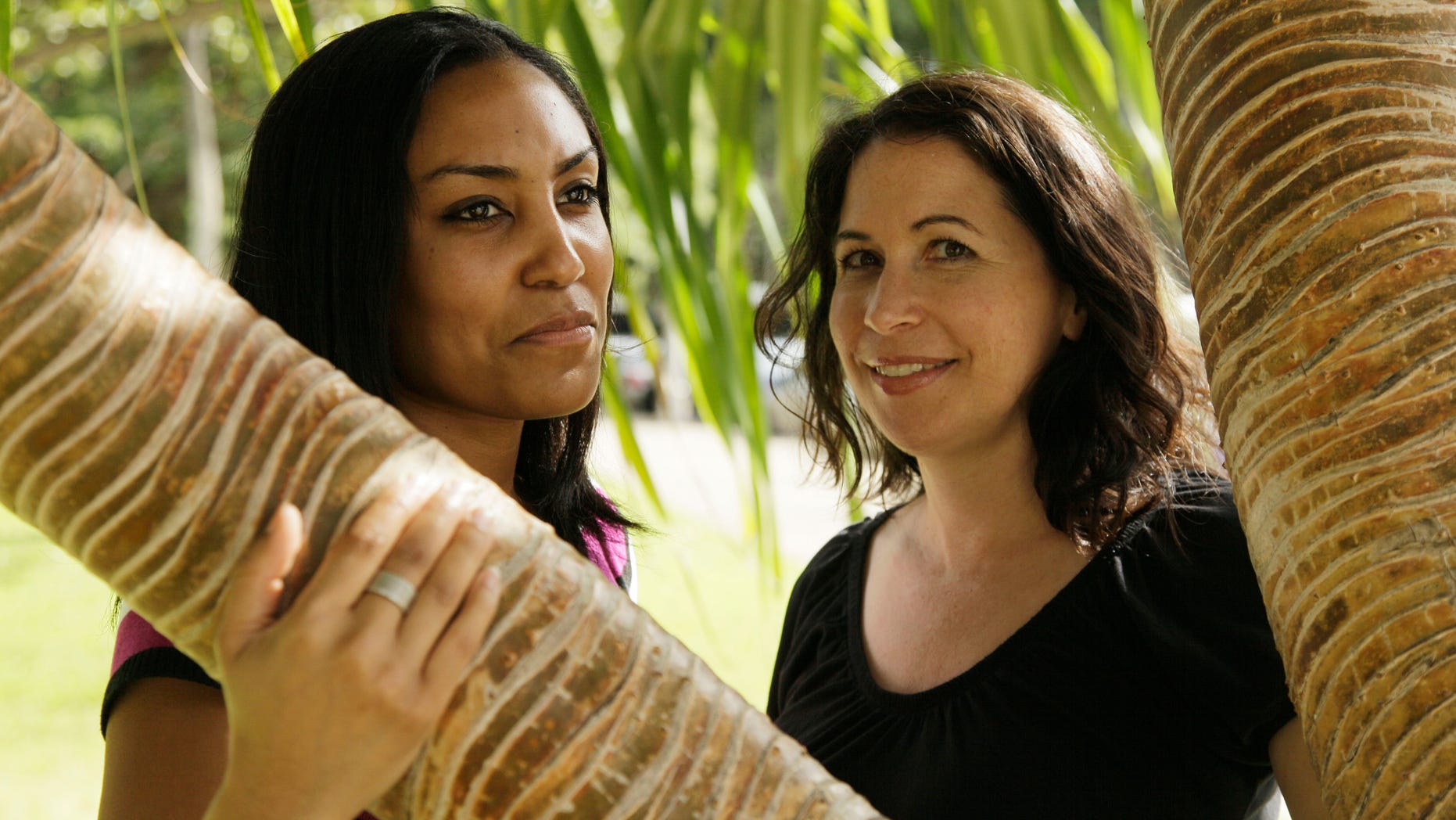 In this Dec. 19, 2011 file photo, Taeko Bufford, left, and Diane Cervelli, right, pose near Waikiki beach in Honolulu.