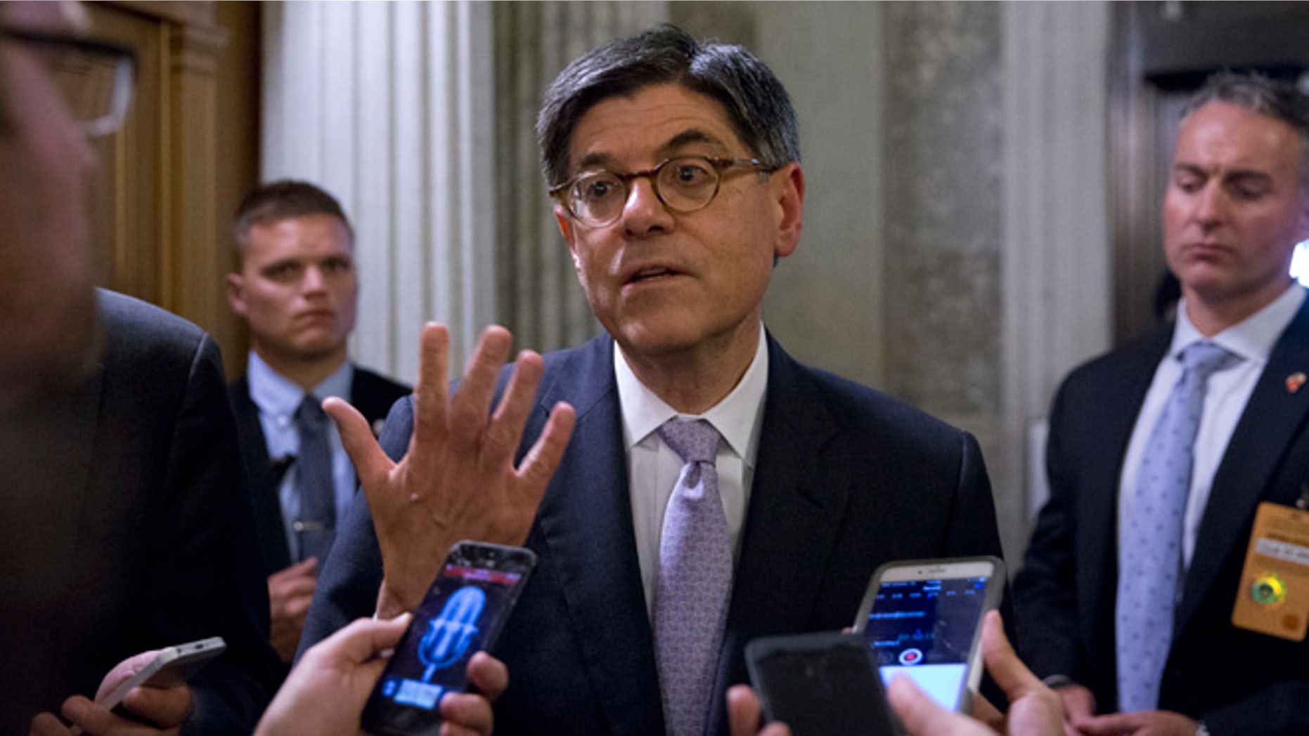 Treasury Secretary Jacob Lew talks with reporters in Washington, Tuesday, June 21, 2016.
