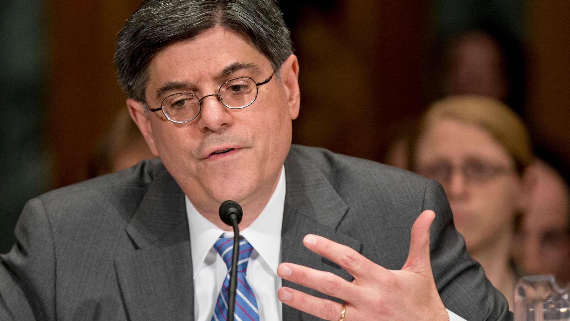 Jack Lew testifies during his confirmation hearing on Capitol Hill in Washington before the Senate Finance Committee.