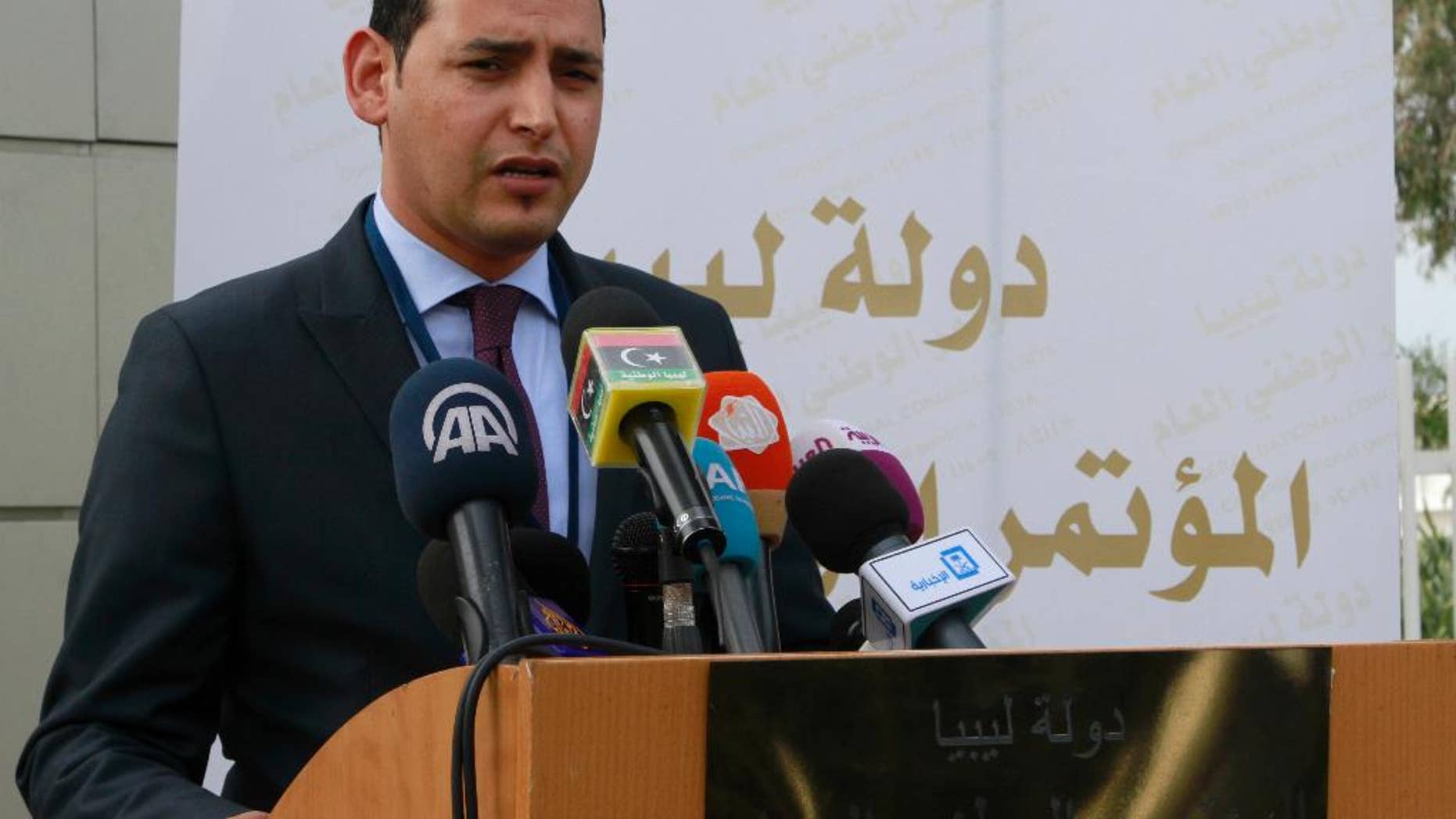 A delegation member of the Tripoli-based General National Congress, Omar Hmeidan speaks to reporters outside the conference center in Skhirat, Morocco on Friday, March 13, 2015 during the U.N.-sponsored Libyan peace talks. The fate of the talks has been thrown into doubt after the delegation from the internationally recognized parliament in Tobruk did not show up. (AP/Paul Schemm)