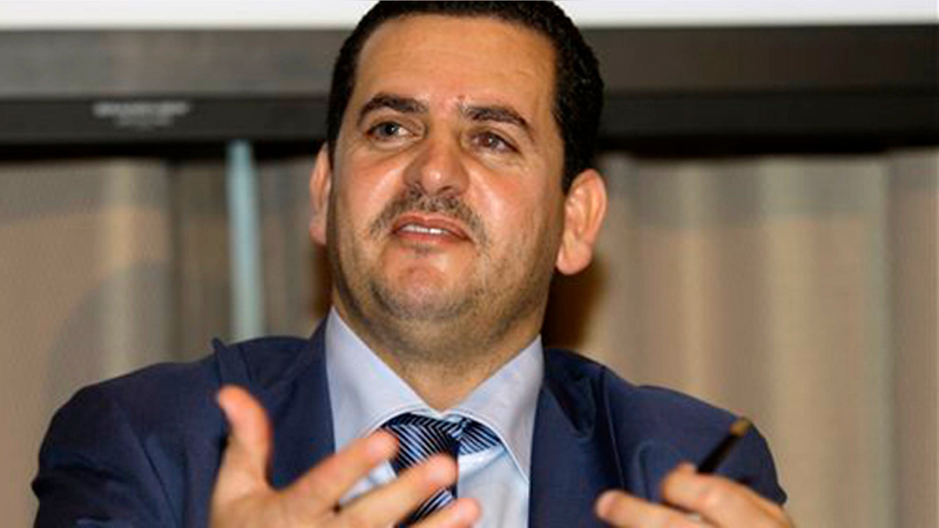 Abdulhadi Lahweej, Libya's undersecretary for Expatriates, Immigrants and Refugee Affairs, answers questions during a news conference at the financial district of Makati, south of Manila, Philippines on Monday Aug. 1, 2011.