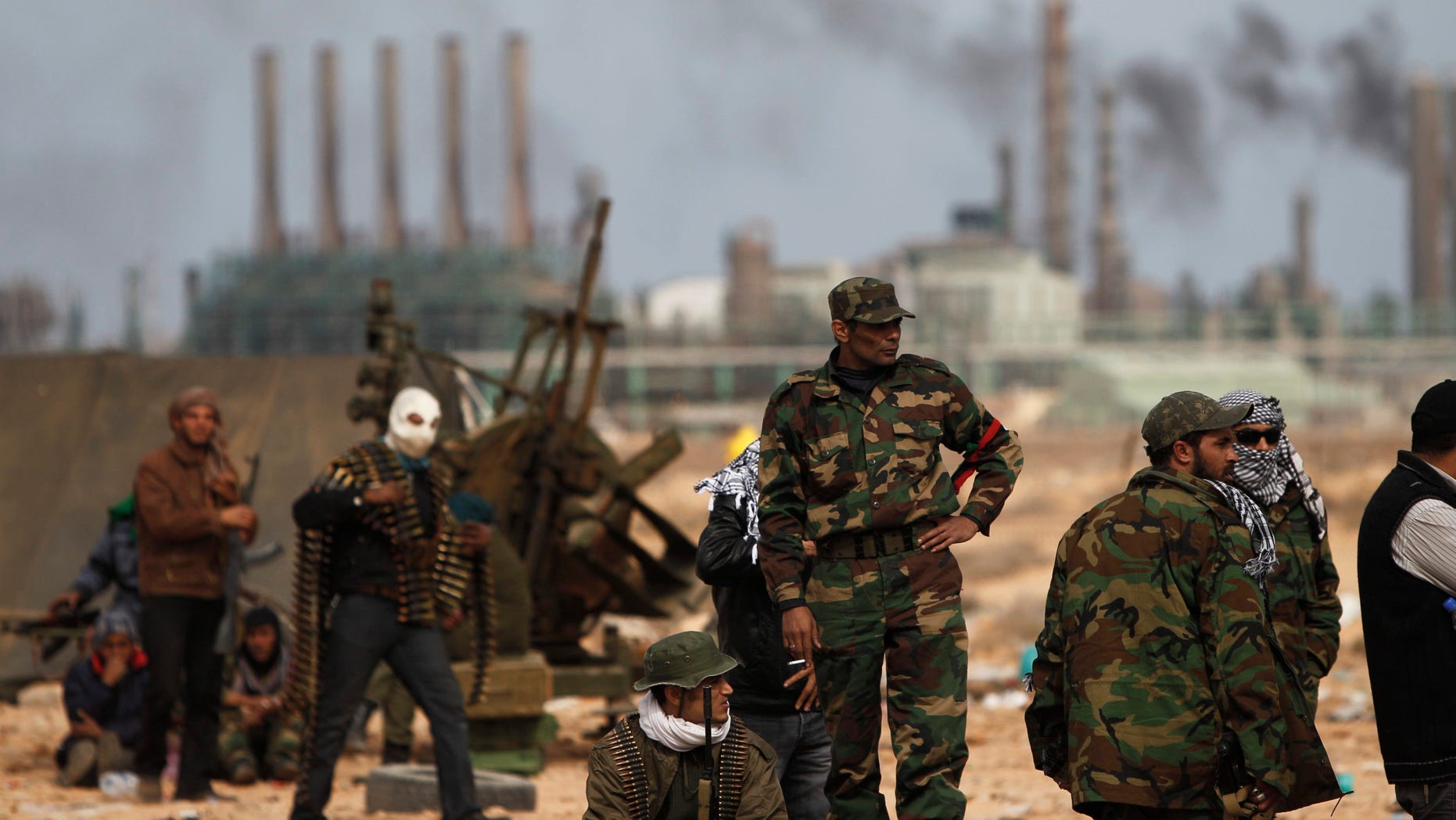 March 10: Libyan volunteers stand on the outskirts of the eastern town of Ras Lanouf, Libya.