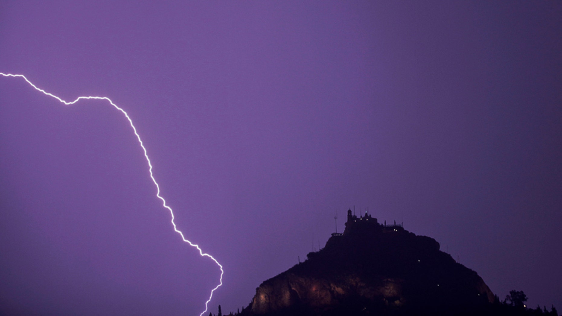 File photo - Lightning strikes over Lycabettus hill in Athens, October 24, 2014.