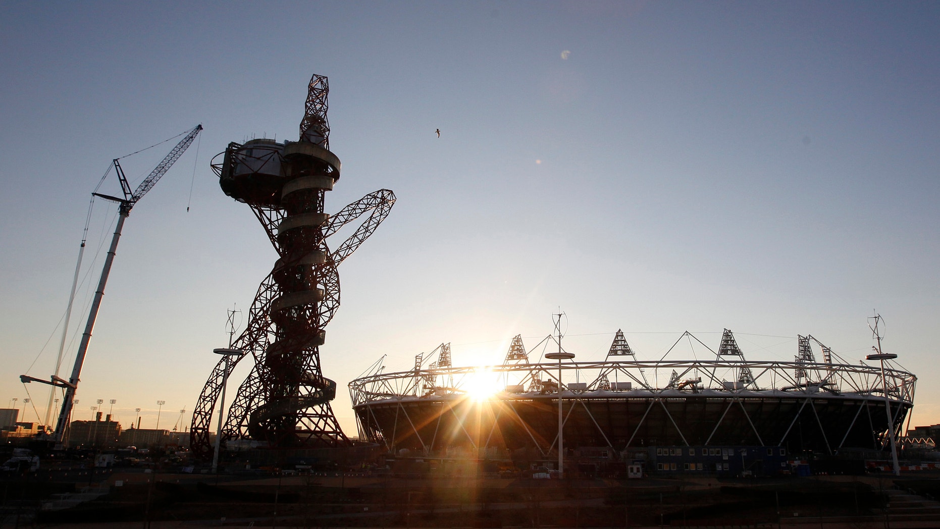 The London 2012 Olympic Stadium is seen at about sunset, with the partially completed ArcelorMittal Orbit at the Olympic Park in London.