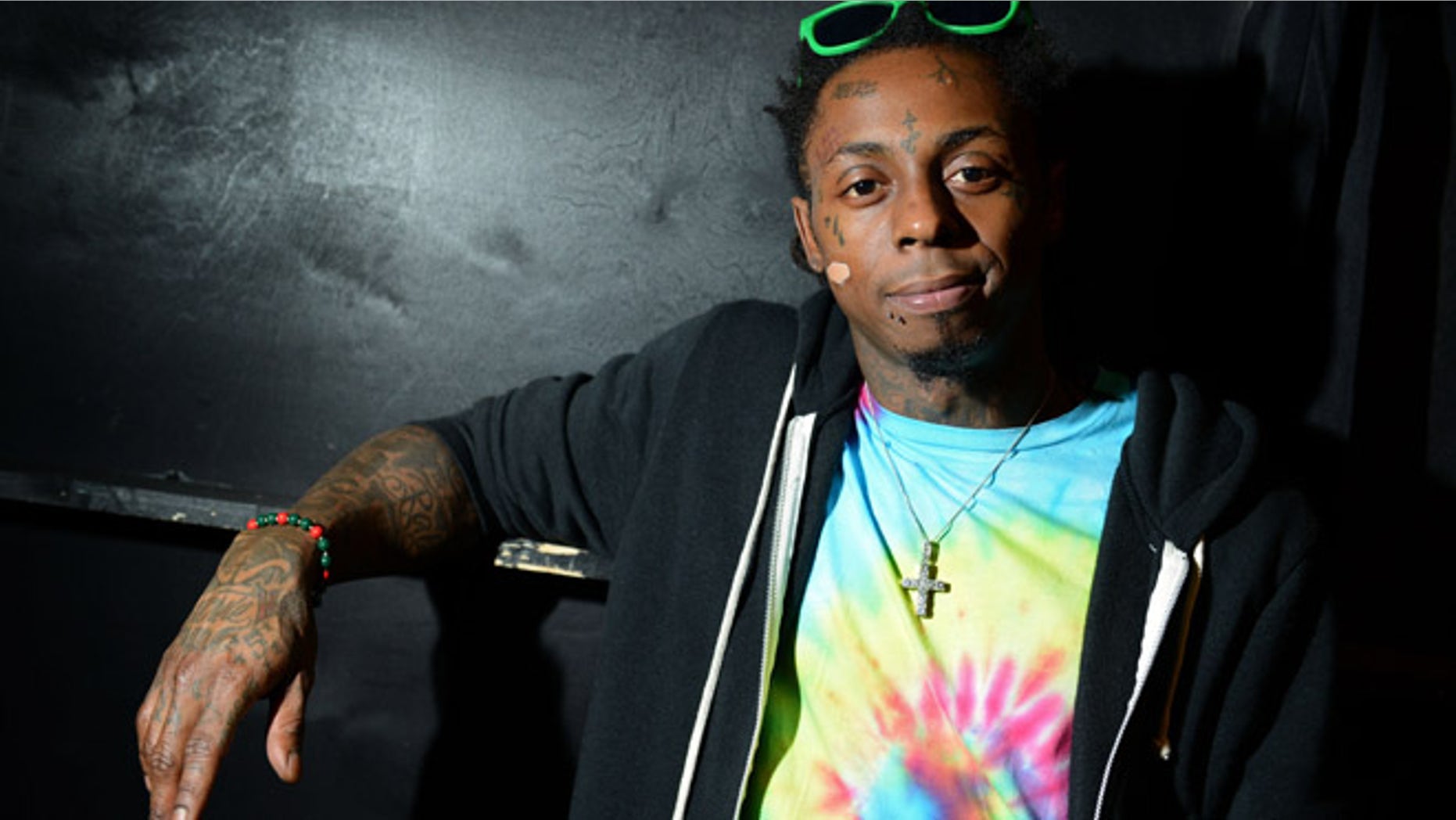 Feb. 1, 2013: In this file photo, recording artist Lil Wayne meets fans and celebrates his contemporary street wear apparel brand TRUKFIT at his hometown Macy's, in New Orleans.