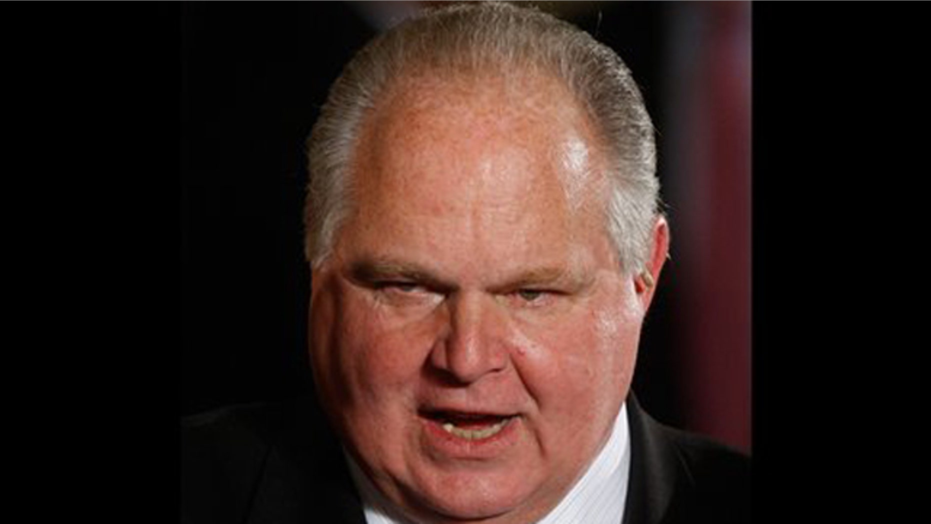 Jan. 13, 2009: In this file photo, conservative talk show host Rush Limbaugh talks with guests in the East Room of the White House in Washington.