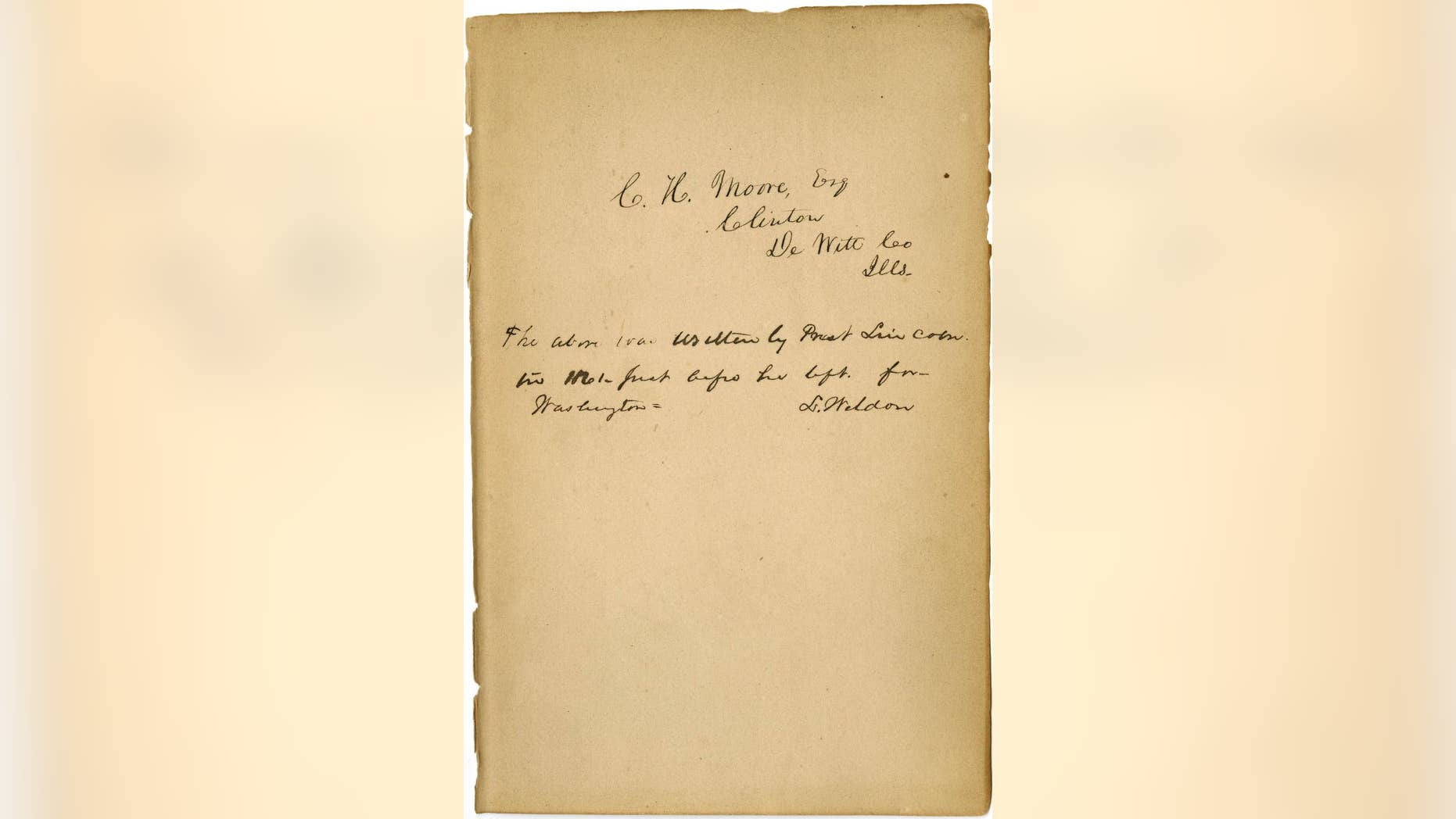 This undated photo provided by the Abraham Lincoln Presidential Library and Museum in Springfield, Ill., shows what historical experts say is Abraham Lincoln's handwriting they’ve found inside a tattered book justifying racism that he may have read to better understand his opponents' thinking on slavery. "Types of Mankind" was published in 1854 and circulated for decades by the Vespasian Warner Public Library in Clinton. Director Joan Rhoades brought the 700-page book to the Abraham Lincoln Presidential Library and Museum in May to determine whether an inscription inside was made by the former president who worked to free the country's slaves through the Emancipation Proclamation. (AP Photo/Courtesy of the Abraham Lincoln Presidential Library and Museum)