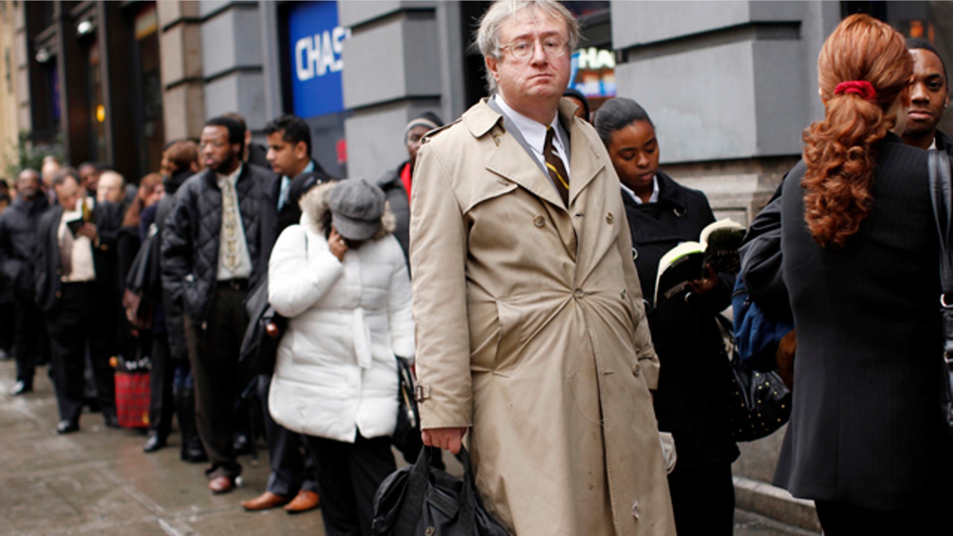 FILE: Eric Lipps, 52, waits in line to enter the NYCHires Job Fair on Dec. 9, 2009, in New York City.