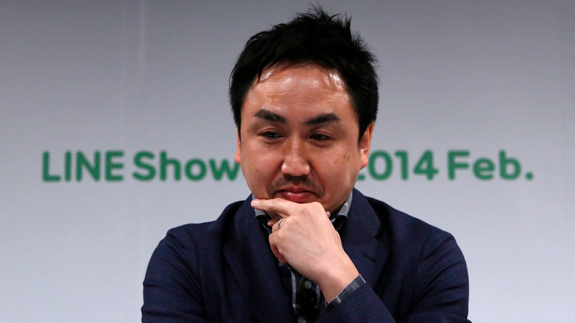 Takeshi Idezawa, chief operating officer of Line Corp, attends an announcement of its new service in Tokyo February 26.