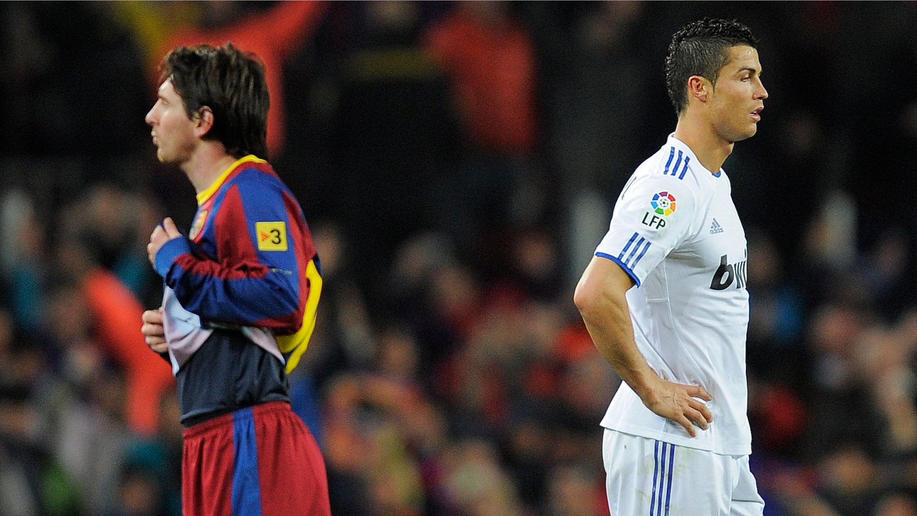 BARCELONA, SPAIN - NOVEMBER 29: Cristiano Ronaldo of Real Madrid (R) and Lionel Messi of FC Barcelona look on during the La Liga match between Barcelona and Real Madrid at the Camp Nou Stadium on November 29, 2010 in Barcelona, Spain. Barcelona won the match 5-0. (Photo by David Ramos/Getty Images)