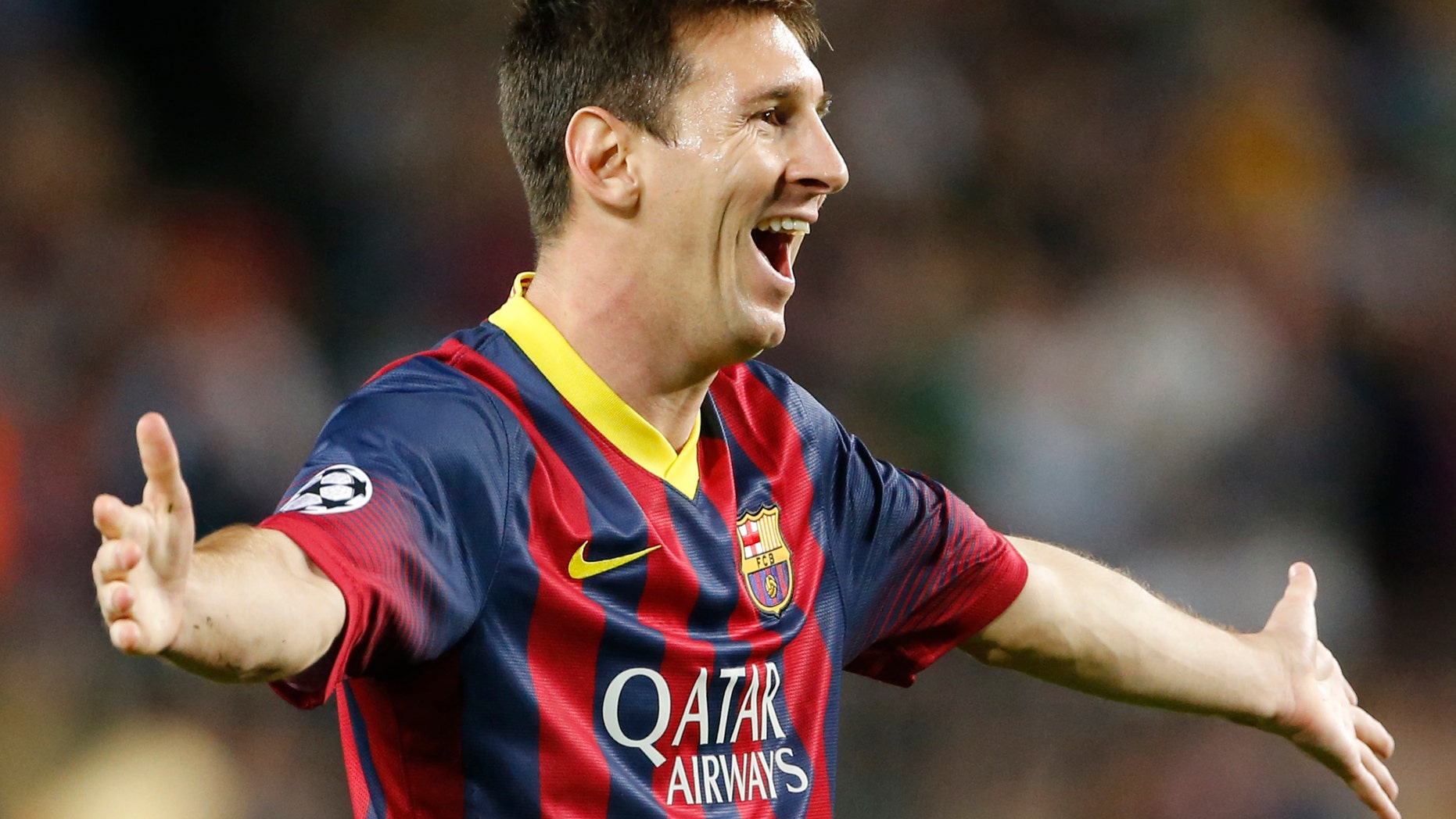 Barcelona's Lionel Messi celebrates scoring 1-0 during the Champions League group H soccer match between Ajax Amsterdam and F.C. Barcelona on Wednesday, Sept. 18, 2013, at Camp Nou stadium in Barcelona, Spain. (AP Photo/Emilio Morenatti)