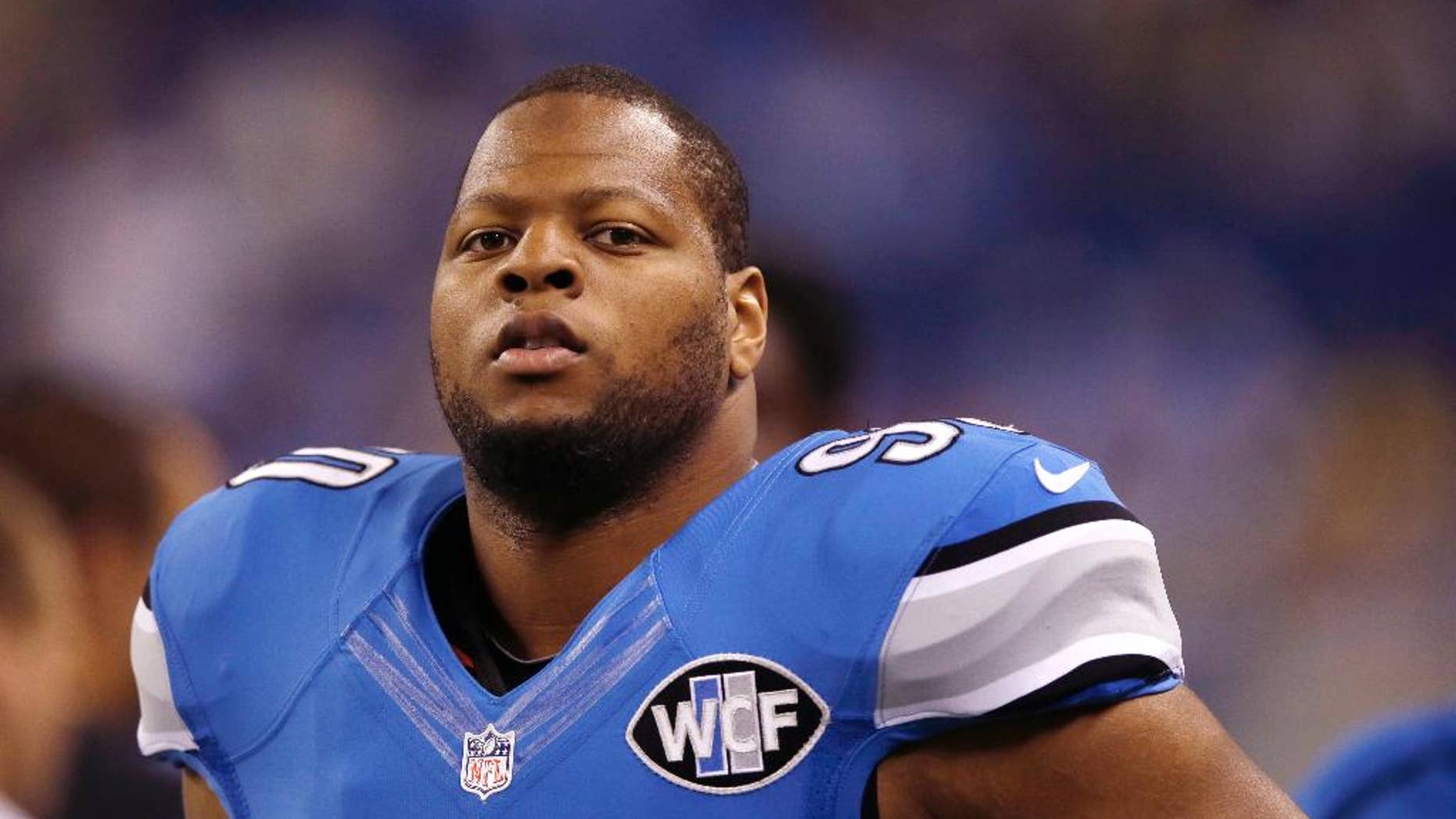 FILE - This Sept. 21, 2014, file photo shows Detroit Lions defensive tackle Ndamukong Suh during warm-ups before an NFL football game against the Green Bay Packers in Detroit. Suh can become a free agent after this season, and there's already talk he could be headed elsewhere, but that doesn't seem to be a distraction for the Lions. (AP Photo/Carlos Osorio, File)