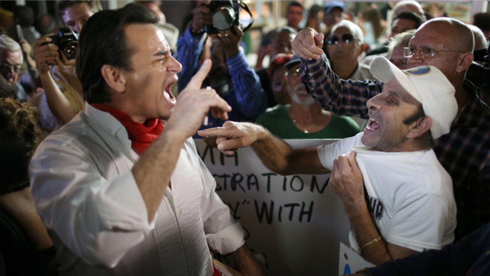 Argument over the normalization of relations between the U.S. and Cuba outside the Little Havana restaurant Versailles on December 17, 2014 in Miami, Florida. (Photo by Joe Raedle/Getty Images)