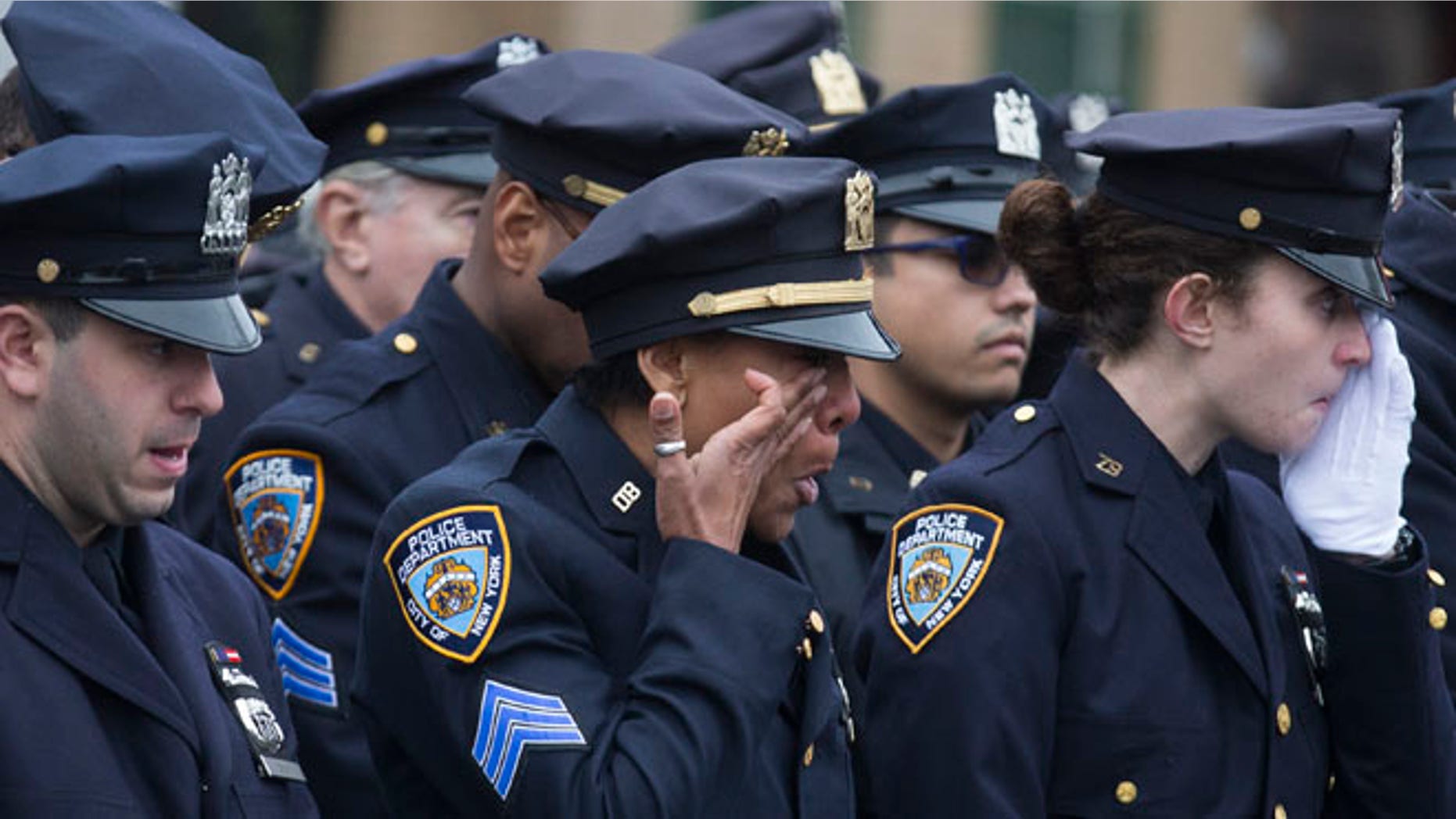 Jan. 4, 2015: Police officers at funeral for New York police Officer Wenjian Liu at Aievoli Funeral Home, Brooklyn, N.Y.