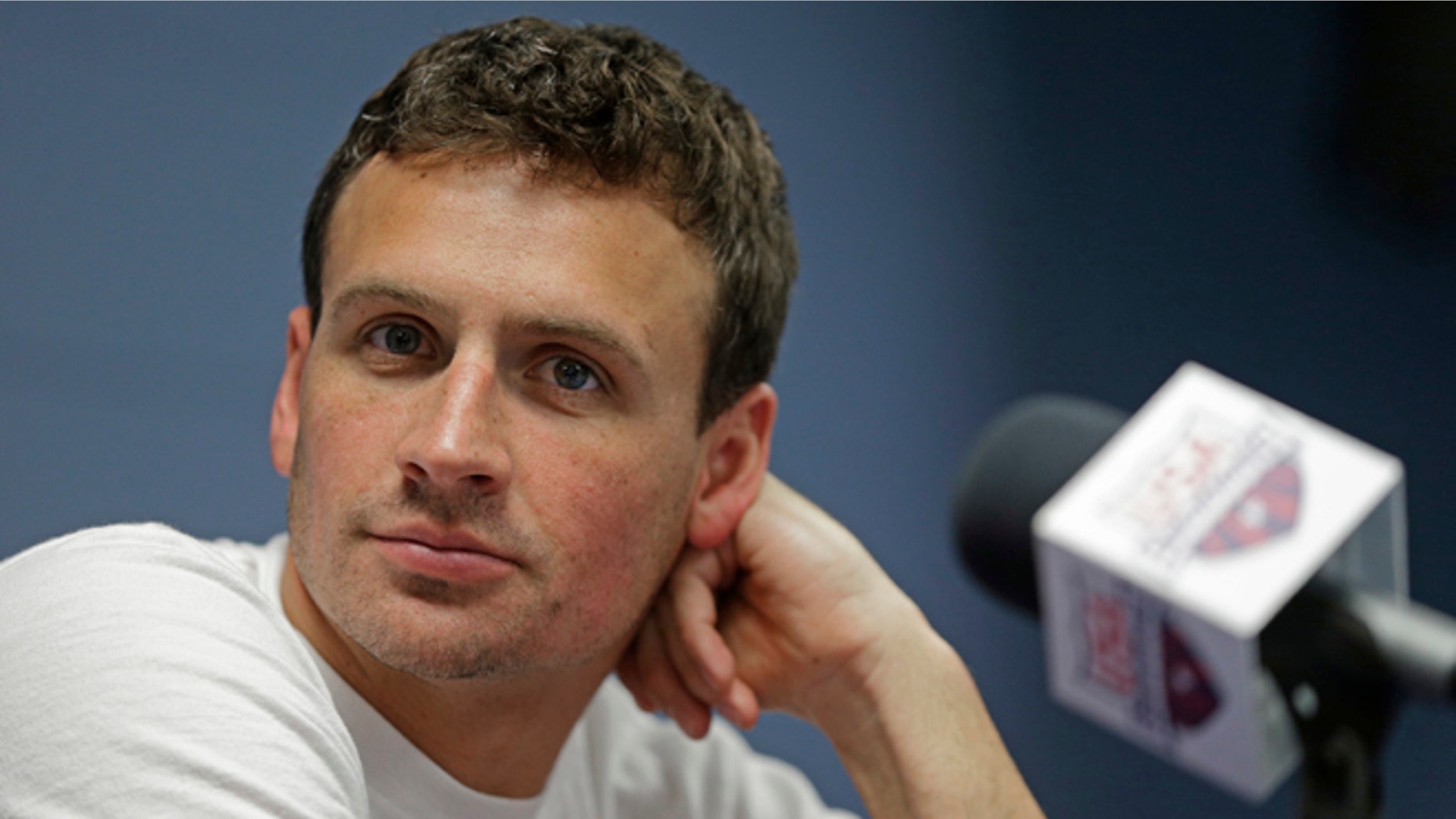 FILE - In this May 12, 2016, file photo, Ryan Lochte listens to a question from the media in Charlotte, N.C. Missy Franklin and Ryan Lochte will be busy in the pool at the Rio Olympics. Just not as busy as they wanted to be. The two popular stars from the U.S. swimming team four years ago in London have just three individual events between them in Rio, hardly the frenetic schedule they've grown accustomed to over the years. (AP Photo/Chuck Burton, File)