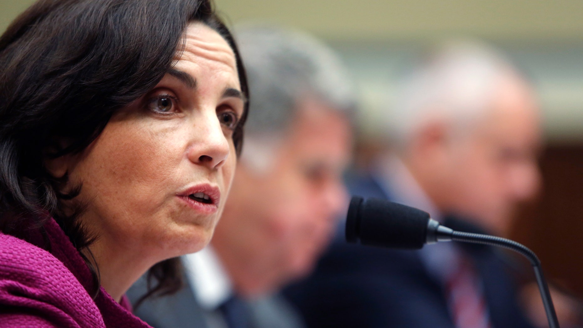 Former Internal Revenue Service (IRS) counsel Jennifer O'Connor, currently of the White House Counsel's Office, testifies about e-mails of former IRS official Lois Lerner during a House Oversight and Government Reform Committee hearing on Capitol Hill in Washington June 24, 2014. Republicans accused the U.S. Internal Revenue Service on Monday of hiding emails written by Lerner and obstructing a congressional inquiry into a controversy involving past IRS treatment of conservative groups. REUTERS/Jonathan Ernst (UNITED STATES - Tags: POLITICS BUSINESS) - RTR3VHHJ