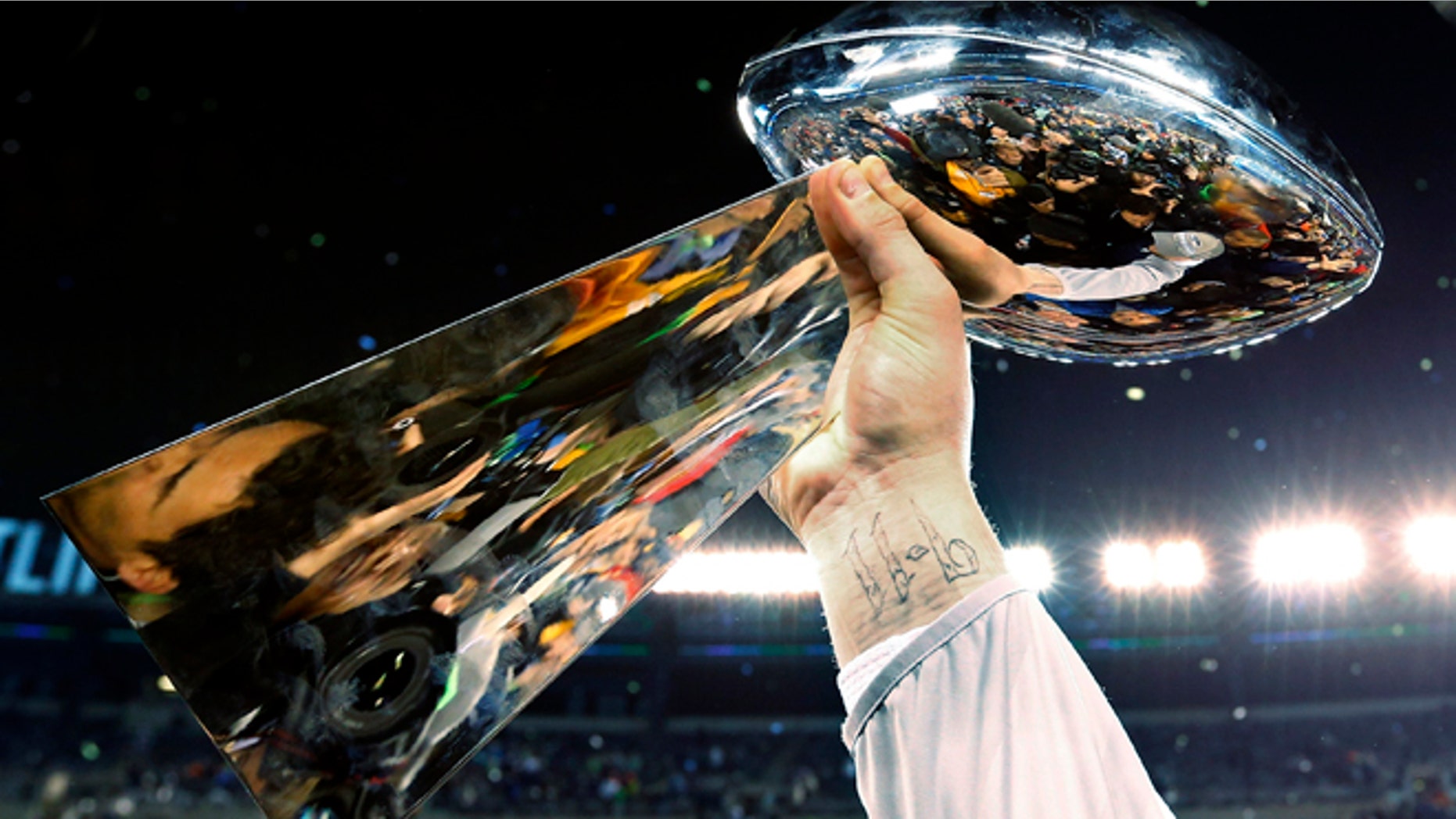 Feb. 2, 2014: The Lombardi Trophy is raised during celebrations after the NFL Super Bowl XLVIII football game.