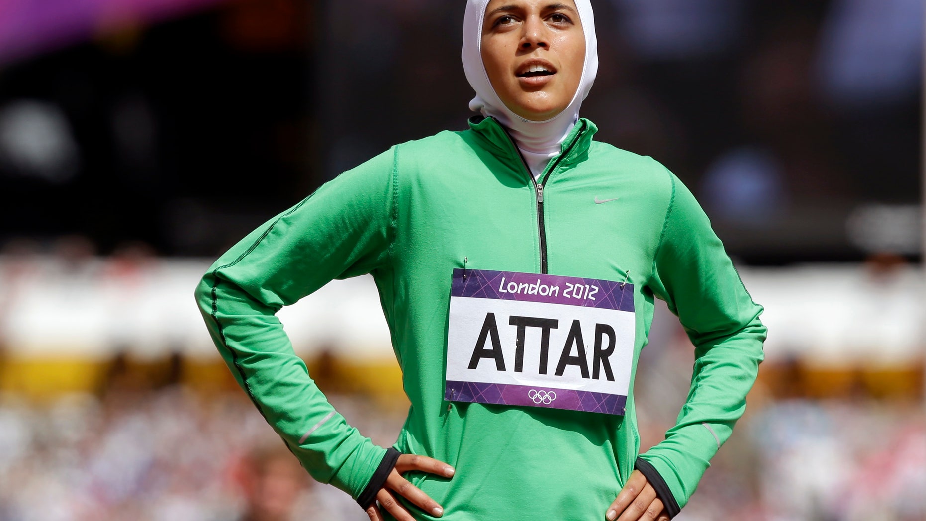 Saudi Arabia's Sarah Attar reacts after competing in a women's 800-meter heat during the athletics in the Olympic Stadium at the 2012 Summer Olympics, London, Wednesday, Aug. 8, 2012. Attar is the first Saudi woman to compete in athletics during the Olympics. (AP Photo/Anja Niedringhaus)