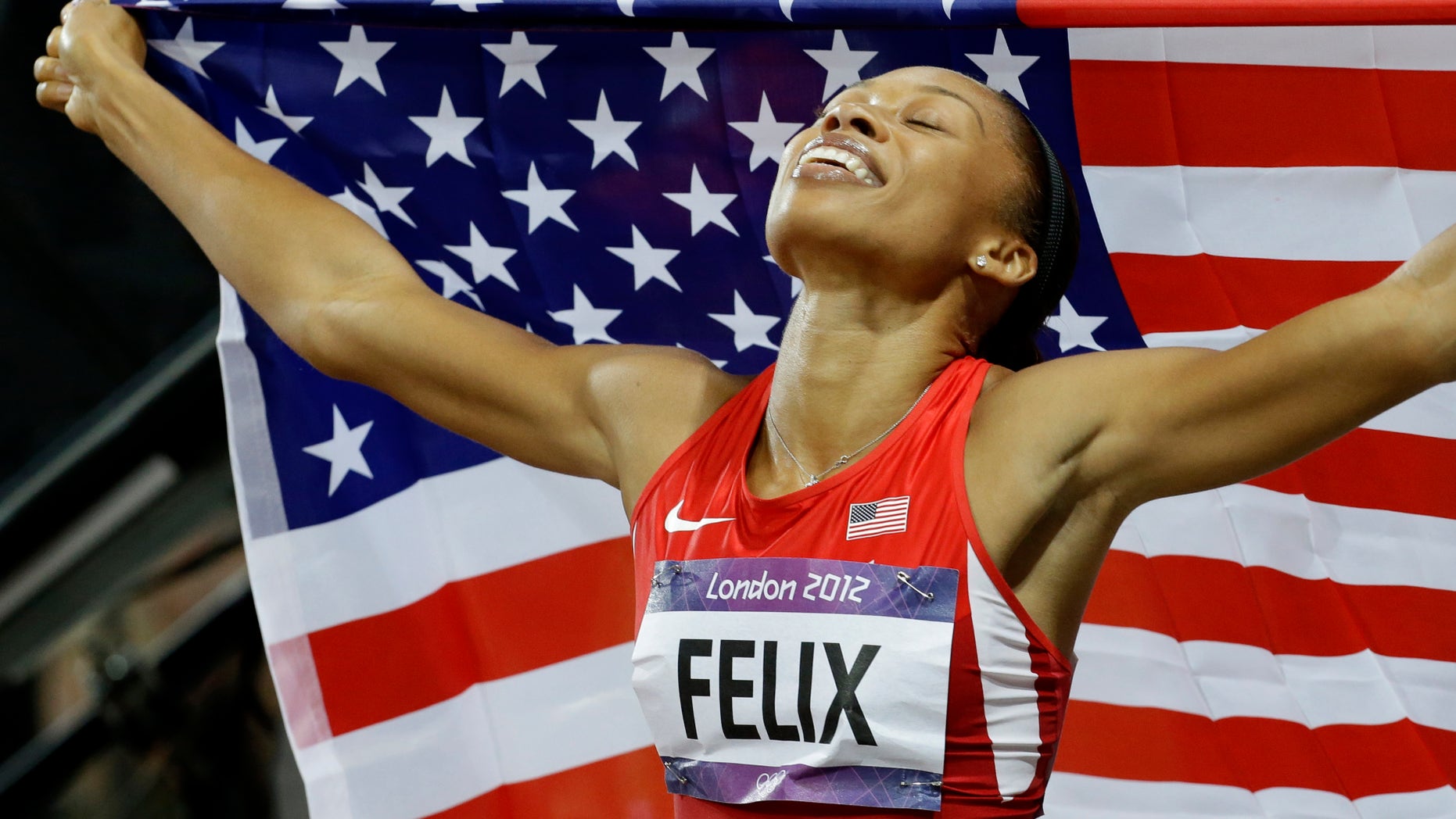United States' Allyson Felix celebrates her in win the women's 200-meters during the athletics in the Olympic Stadium at the 2012 Summer Olympics, London, Wednesday, Aug. 8, 2012. (AP Photo/Lee Jin-man)