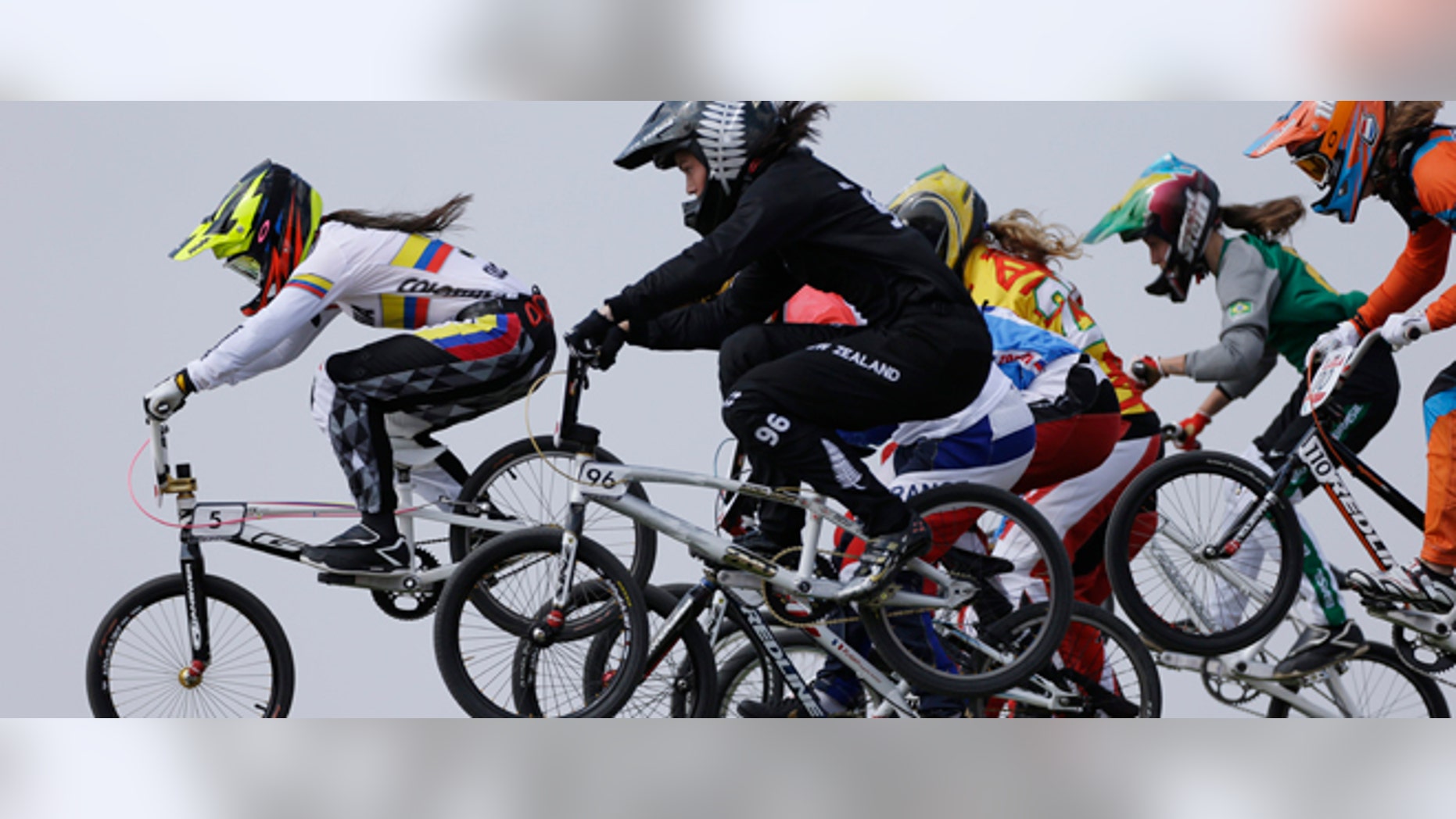 Colombia's Mariana Pajon (5) leads the competition in a BMX cycling women's semifinal run during the 2012 Summer Olympics, Friday, Aug. 10, 2012, in London. (AP Photo/Matt Rourke)