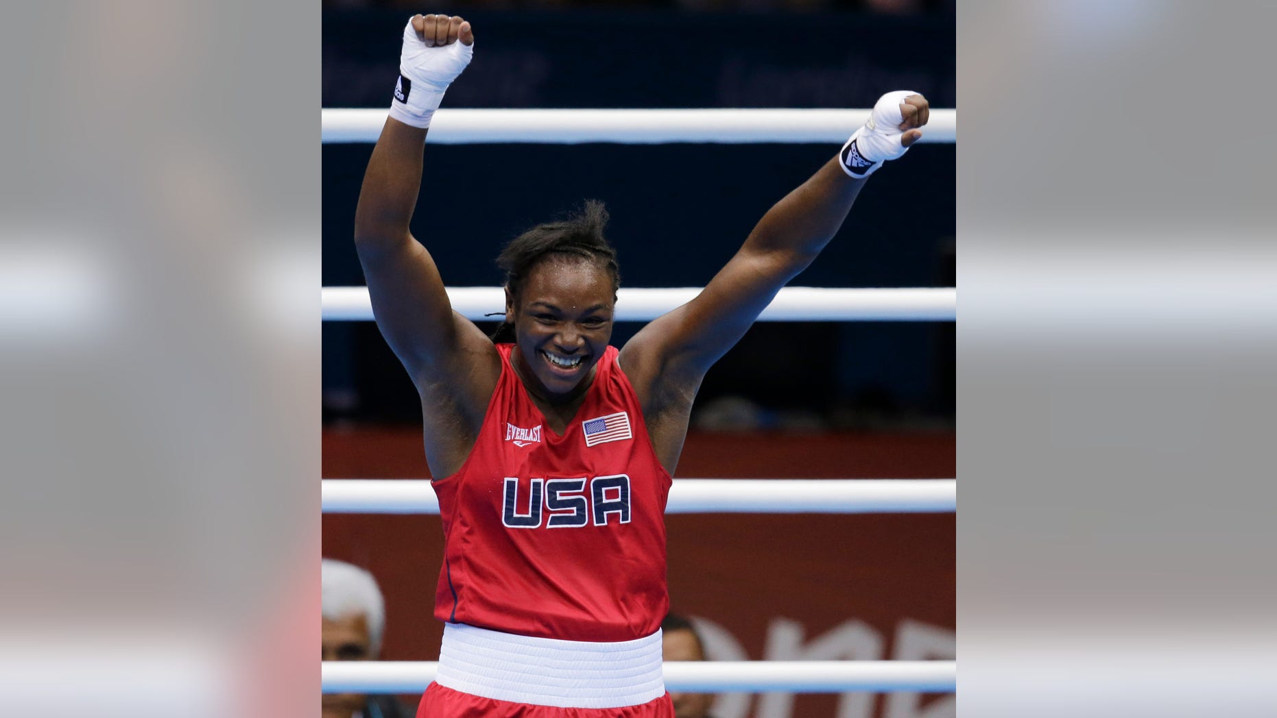The United States' Claressa Shields, celebrates after winning her fight against Russia's Nadezda Torlopova, during the women's middleweight 75-kg boxing gold medal match at the 2012 Summer Olympics, Thursday, Aug. 9, 2012, in London. (AP Photo/Patrick Semansky)