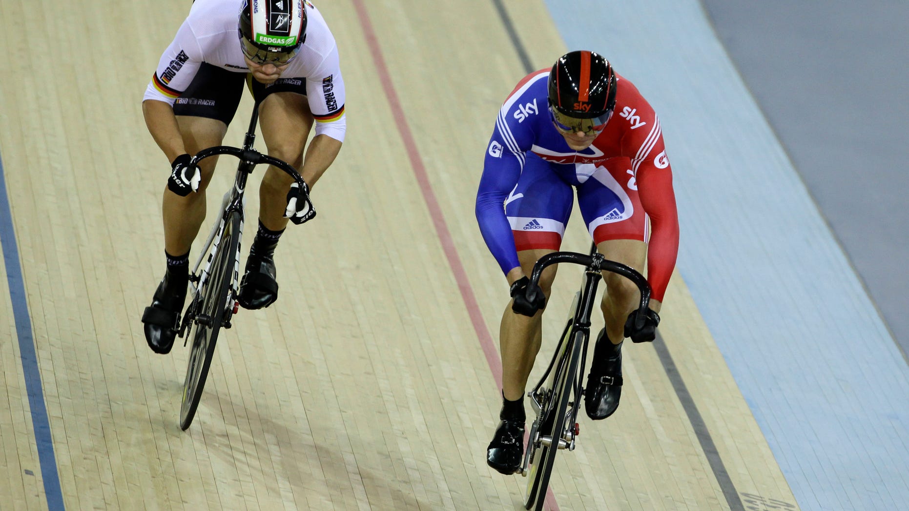 Feb. 19, 2012: In this file photo, gold medalist Britain's Chris Hoy, right, races silver medalist Germany's Maximilian Levy in their men's sprint race final during the World Cup track cycling meeting at the London 2012 Olympic Velodrome at the Olympic Park in London.