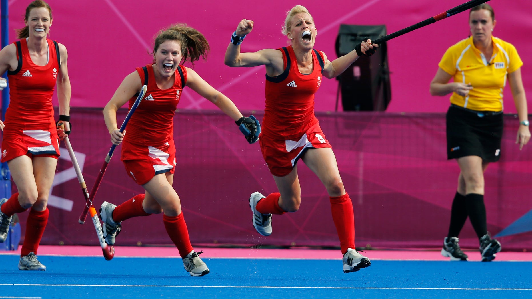 Britain's Alex Danson, right, celebrates after scoring a goal against New Zealand during the women's field hockey bronze medal match at the 2012 Summer Olympics, Friday, Aug. 10, 2012, in London. (AP Photo/Eranga Jayawardena)
