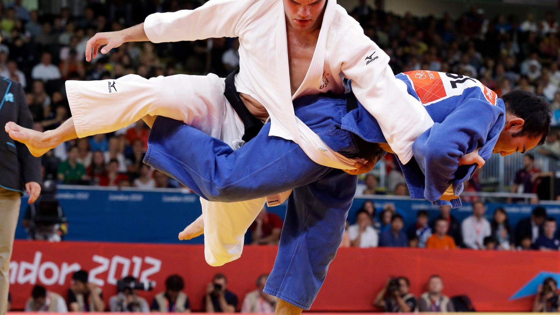 July 30, 2012: Nicholas Delpopolo of the United States, left, and Nyam Ochir Sainjargal of Mongolia compete during the men's 73-kg judo competition at the 2012 Summer Olympics in London.