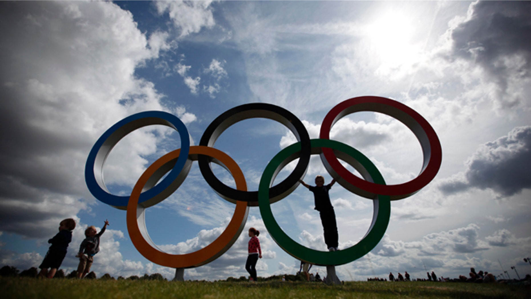 July 30, 2012: Children play on the Olympic rings at the rowing venue.