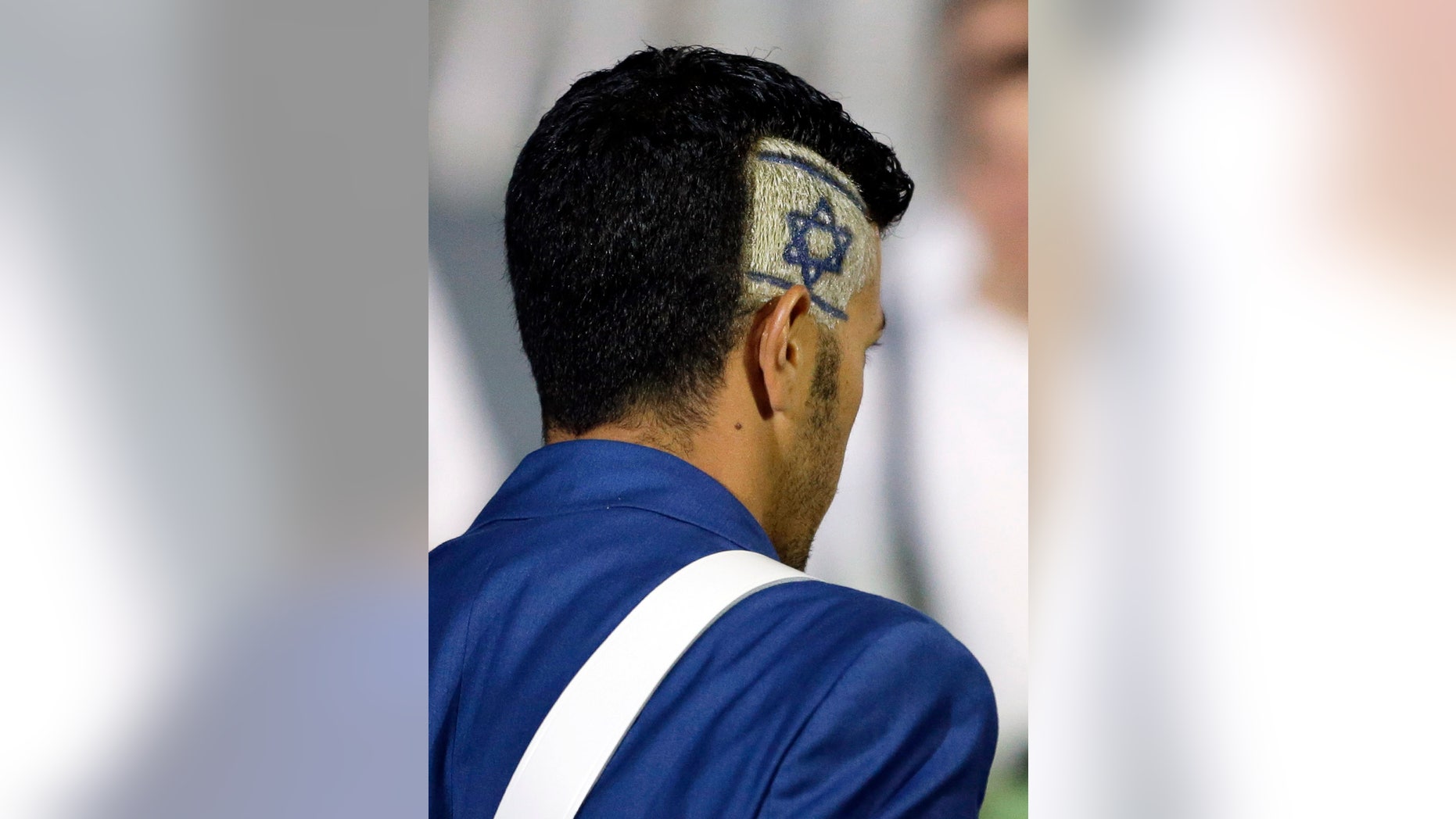 An Israeli athlete has his country's flag as a part of his a hairstyle during the Opening Ceremony at the 2012 Summer Olympics, Friday, July 27, 2012, in London. (AP Photo/Matt Slocum)