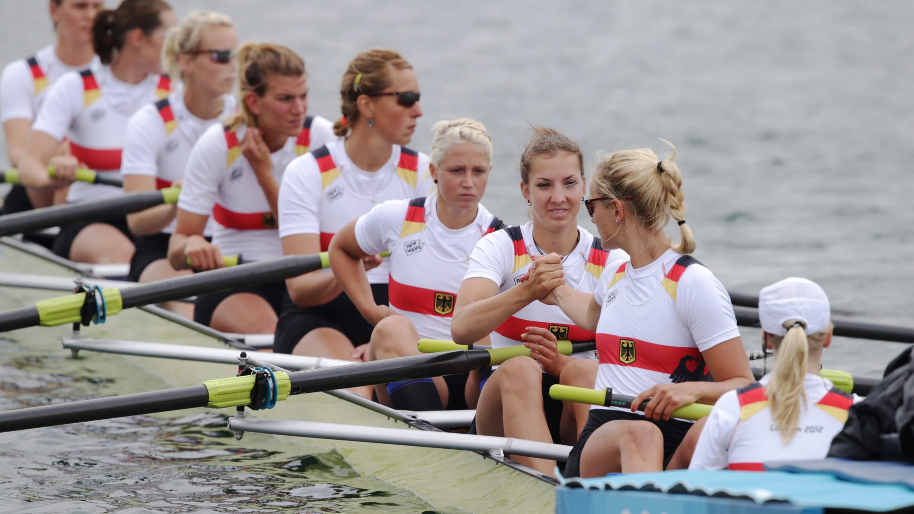 Germany's, from right, Laura Schwensen, Costanze Siering, Kathrin Marchand, Nadja Drygalla, Ulrike Sennewald, Katrin Thiem, Daniela Schultze, Julia Lepke, and Ronja Schett prior to the start of women's rowing eight repechage in Eton Dorney, near Windsor, England, at the 2012 Summer Olympics, Tuesday, July 31, 2012. They finished last and failed to qualify to the final. (AP Photo/Armando Franca)