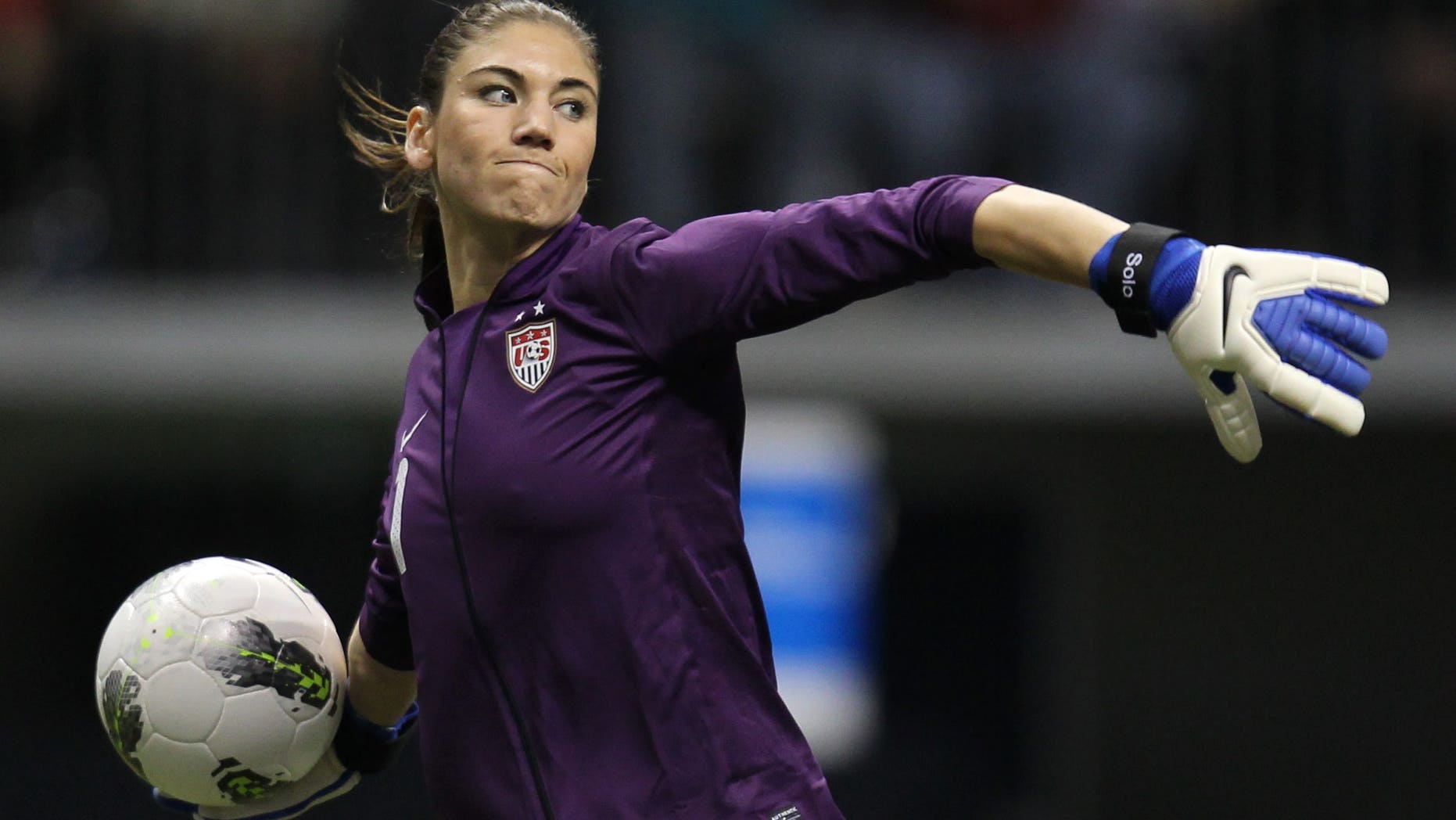 FILE - In this Friday, Jan. 27, 2012 file photo, United States goalkeeper Hope Solo (1) clears the ball from in front of her net during the second half against Costa Rica at the CONCACAF women's Olympic qualifying soccer game action at B.C. Place in Vancouver, Canada. Solo has lots to say heading into the Olympics. And she'll have even more to say once the games are done. The goalkeeper for the U.S. women's soccer team is releasing her memoir on Aug. 14 _ two days after the closing ceremony. (AP Photo/The Canadian Press, Jonathan Hayward, File)