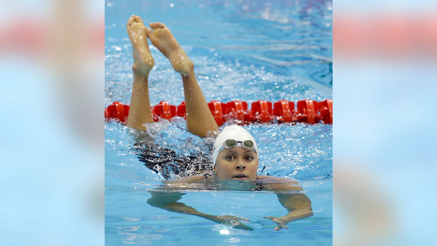 United States' Elizabeth Beisel reacts after competing in a women's 200-meter backstroke swimming heat at the Aquatics Centre in the Olympic Park during the 2012 Summer Olympics in London, Thursday, Aug. 2, 2012. (AP Photo/Lee Jin-man)