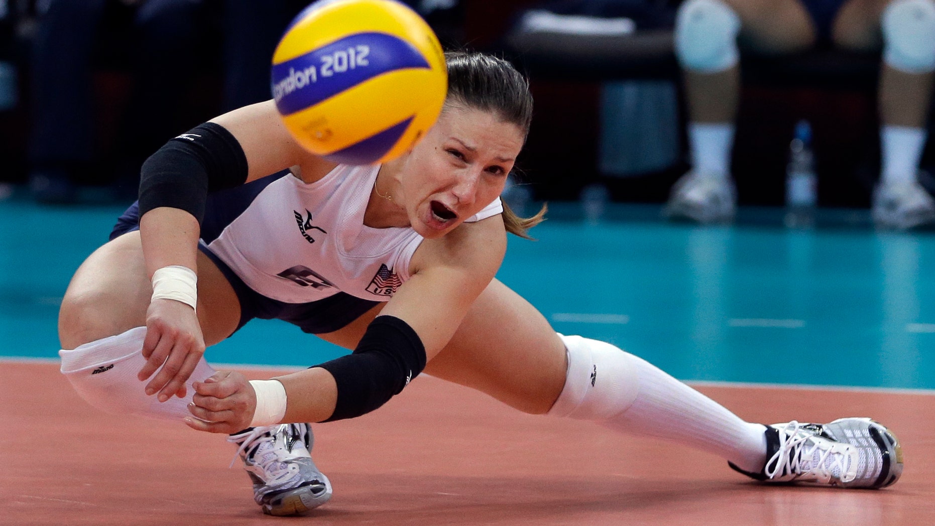 United States' Nicole Davis reaches for the ball during a women's preliminary volleyball match against Brazil at the 2012 Summer Olympics, Monday, July 30, 2012, in London. (AP Photo/Jeff Roberson)