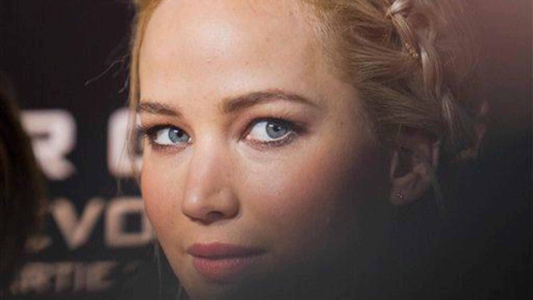 "Attractive" actress Jennifer Lawrence poses for photographers.