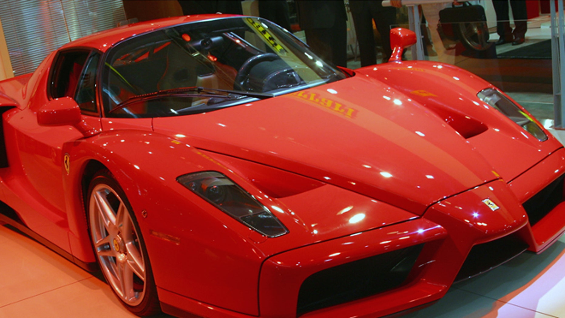 SYDNEY - OCTOBER 17: The new Ferrari Enzo is revealed at the Sydney International Motor Show on October 17, 2002 in Sydney, Australia. The Enzo is modelled on Ferrari's F1 race cars and is the fastest production car in the world. More than 60 cars will be on debut at the Sydney International Motorshow showcasing the latest designs and future concepts from the world's leading Automotive companies. (Photo by Cameron J Spencer/Getty Images)